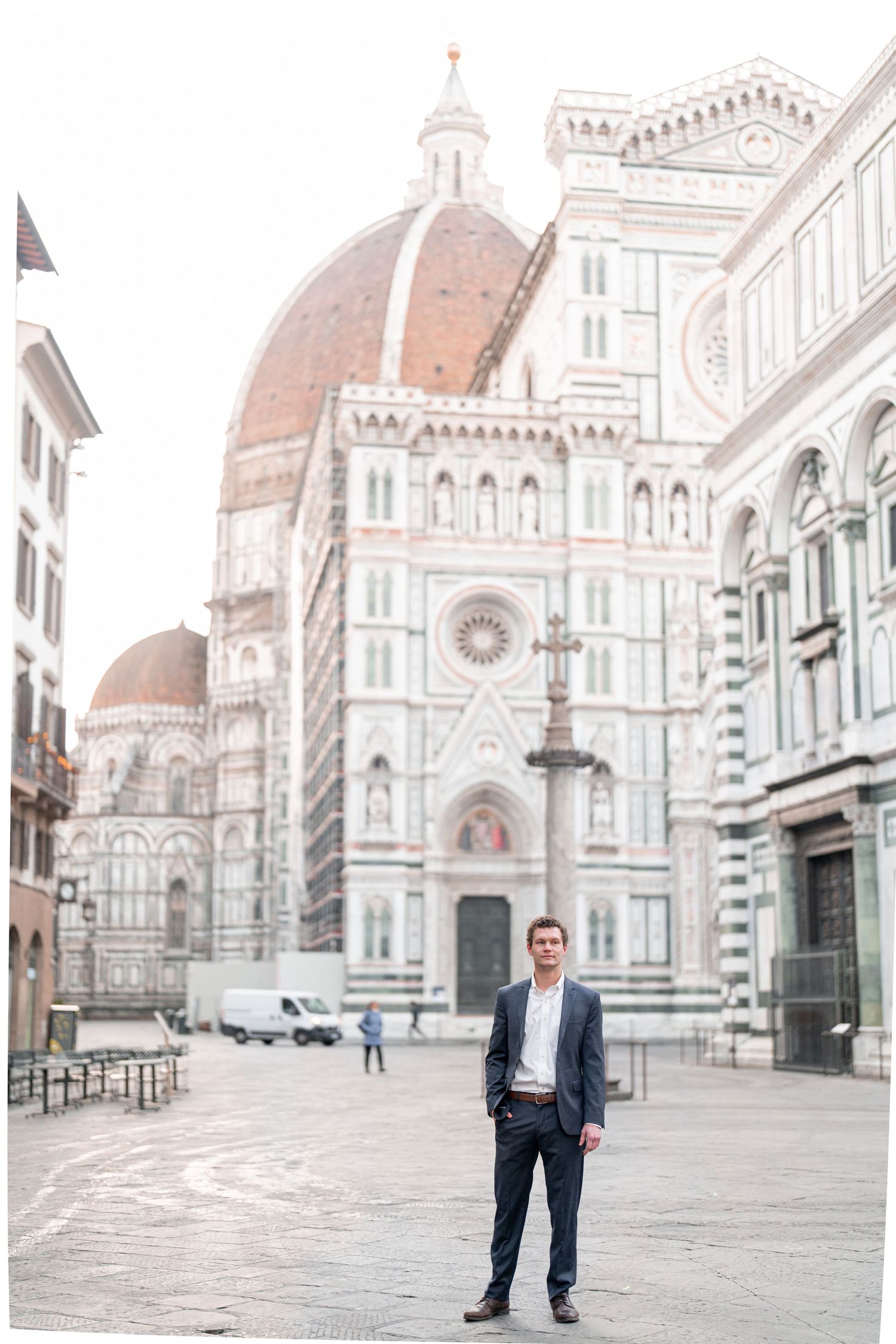 Architectural view of Florence Cathedral's iconic Duomo and historic square in Italy with muted pastel tones.