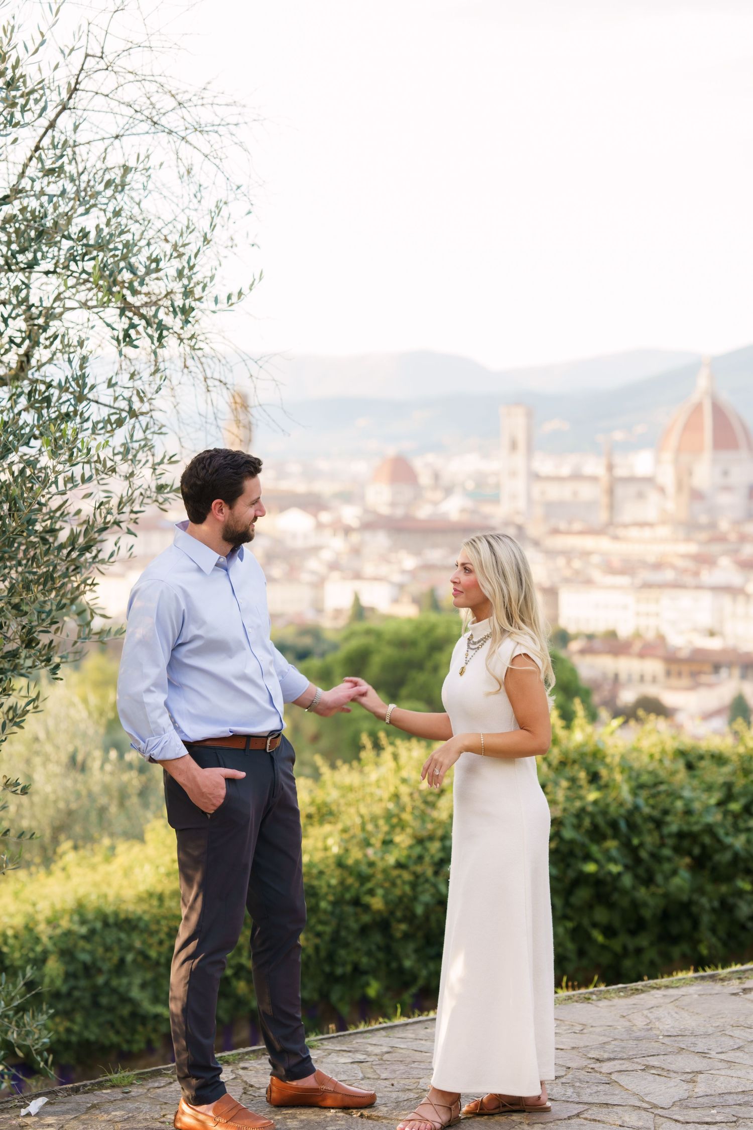 Scenic view of Florence's skyline with the iconic Duomo cathedral visible in the background from a hilltop terrace.