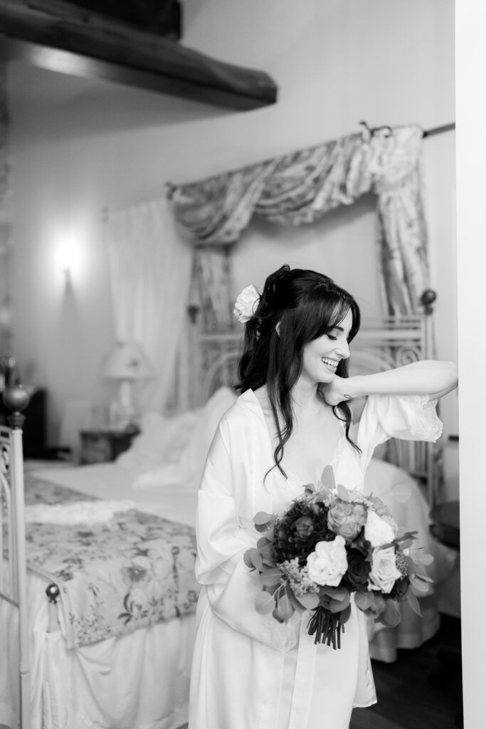 Black and white bridal preparation photos with elegant bouquet in rustic setting.