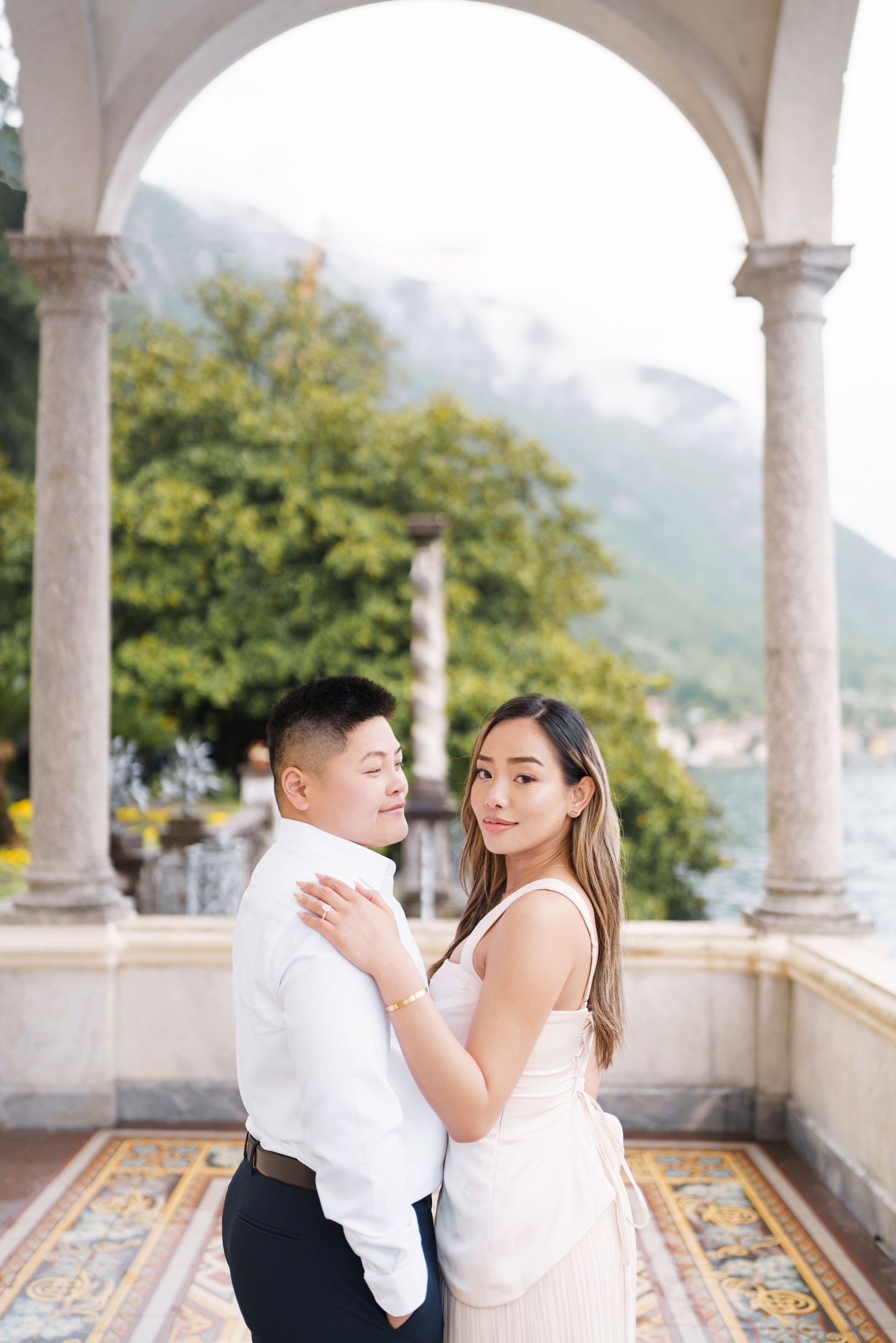 Lake Como proposal photographer capturing surprise engagement at Villa Monastero in Varenna