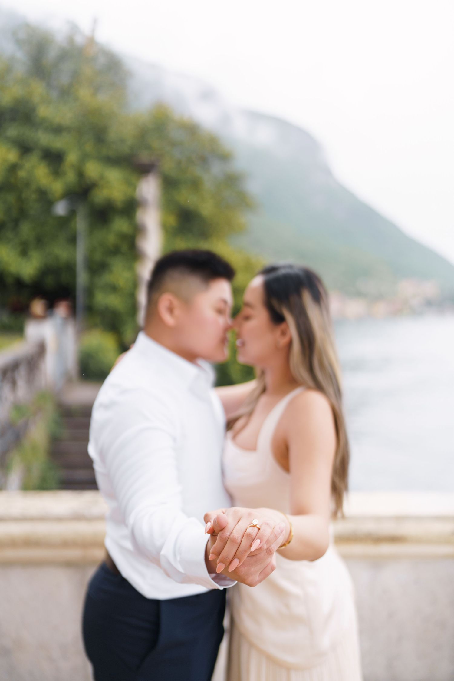 Lake Como proposal photographer capturing surprise engagement at Villa Monastero in Varenna