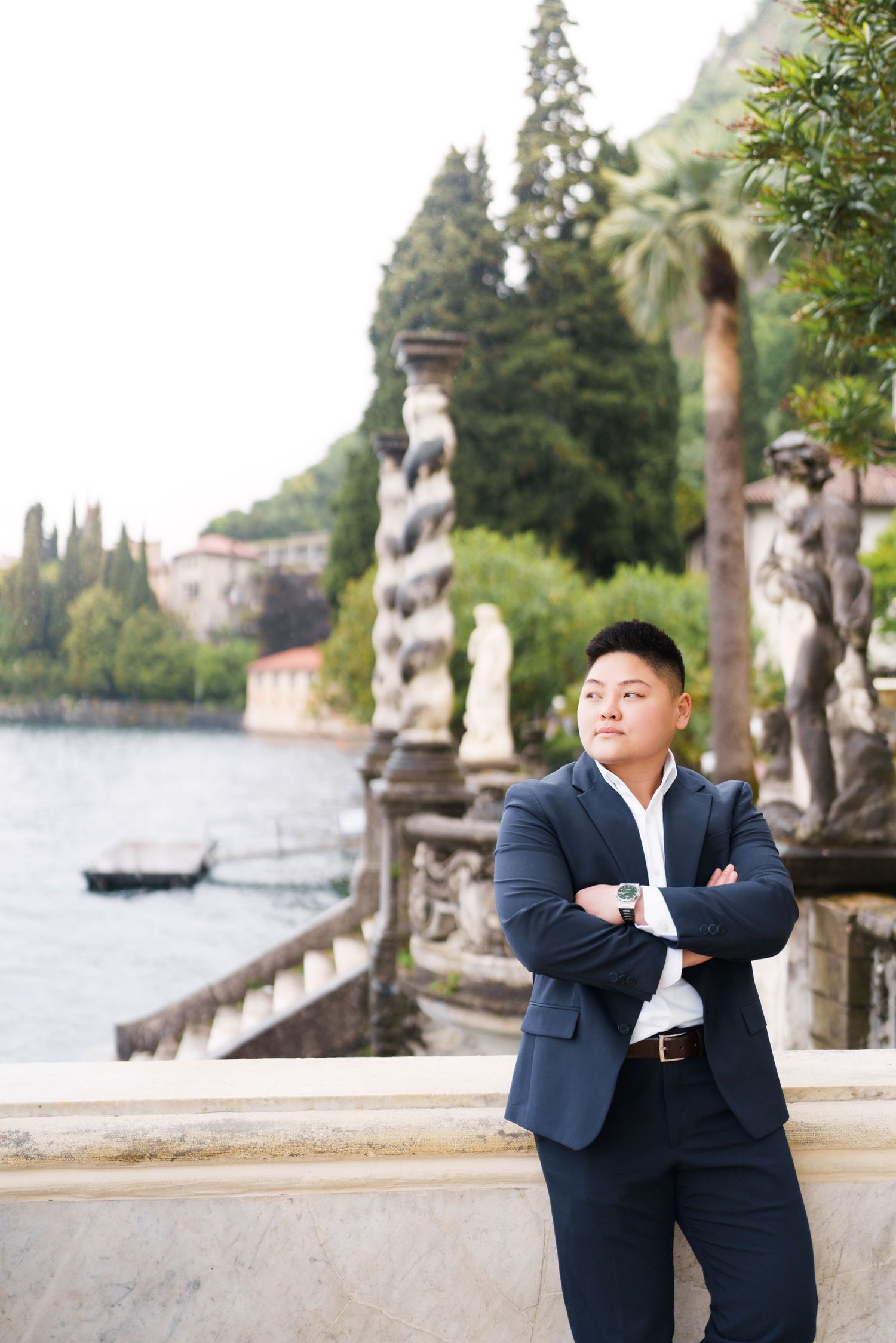 Lake Como proposal photographer capturing surprise engagement at Villa Monastero in Varenna