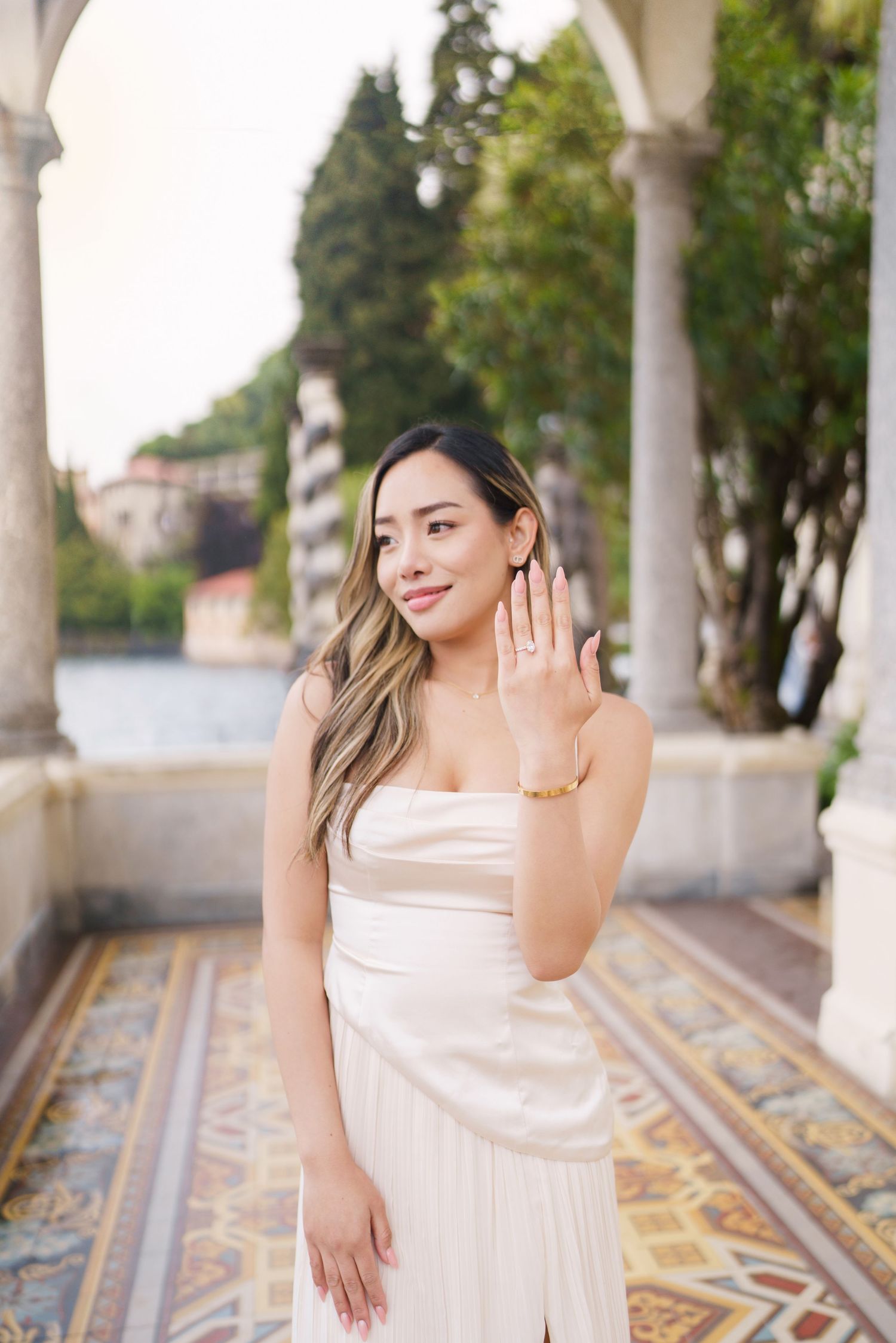 Lake Como proposal photographer capturing surprise engagement at Villa Monastero in Varenna