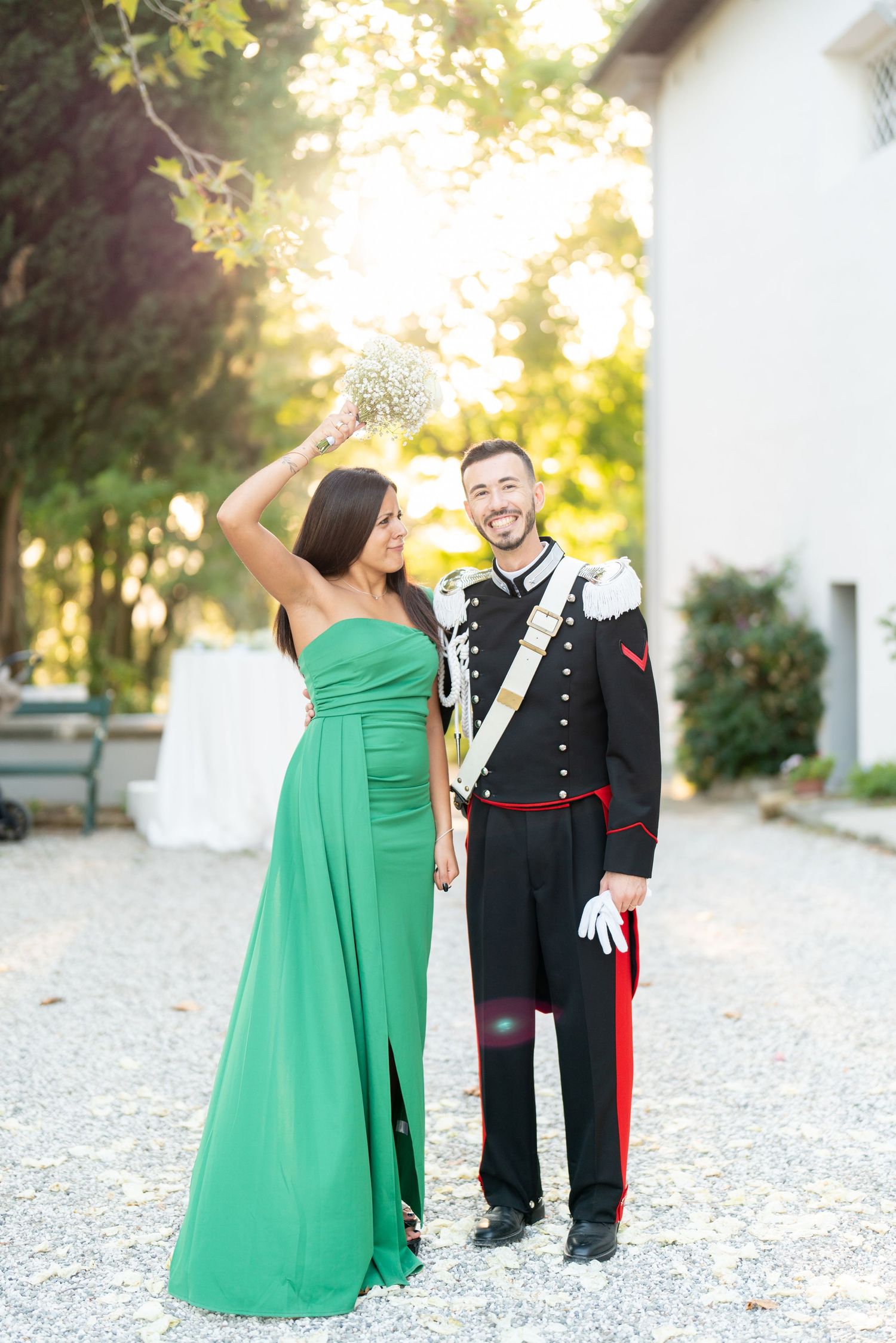 Joyful celebration moment at outdoor event with formal attire.