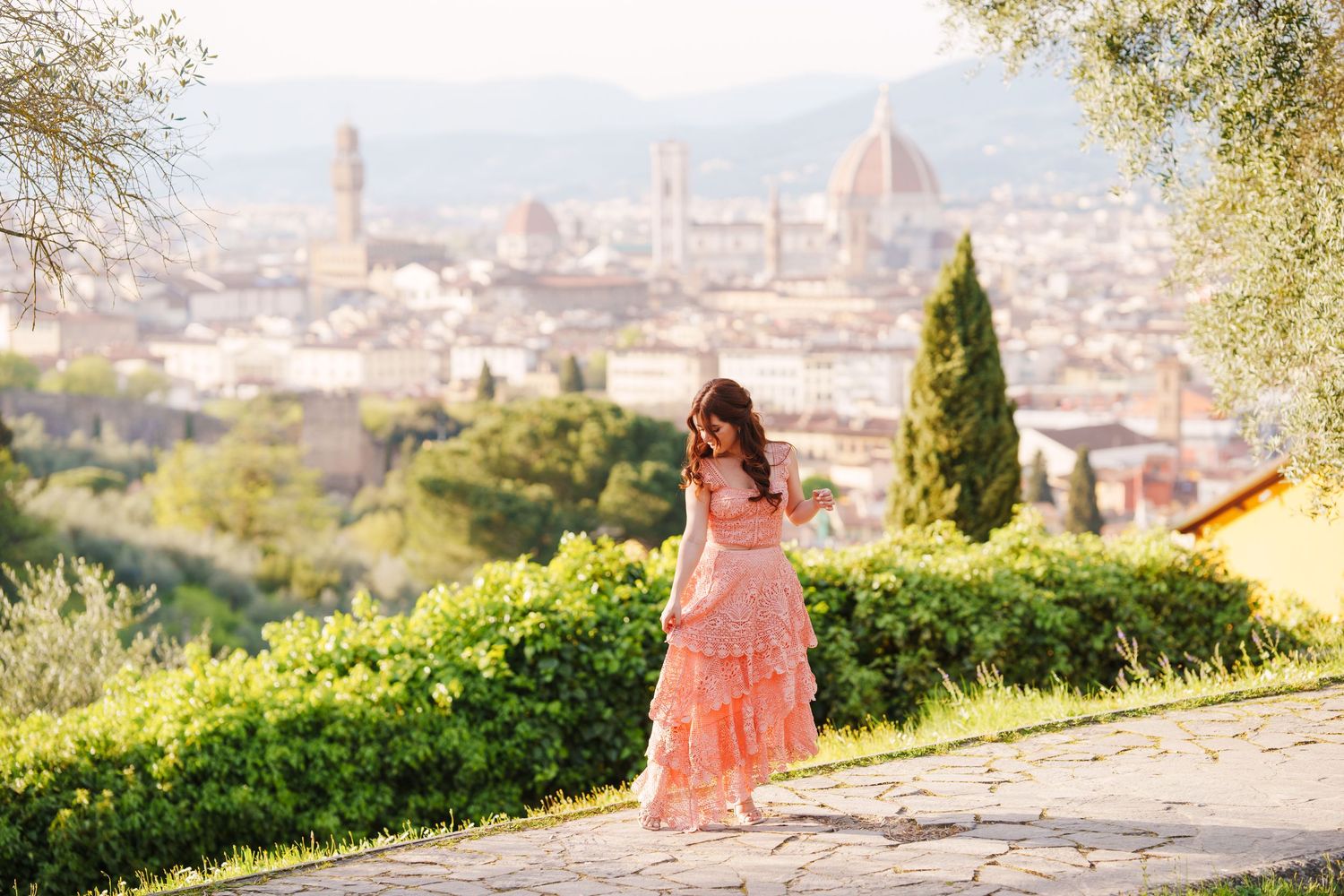 A scenic view of Florence, Italy from Piazzale Michelangelo with the iconic Duomo cathedral visible in the distance.