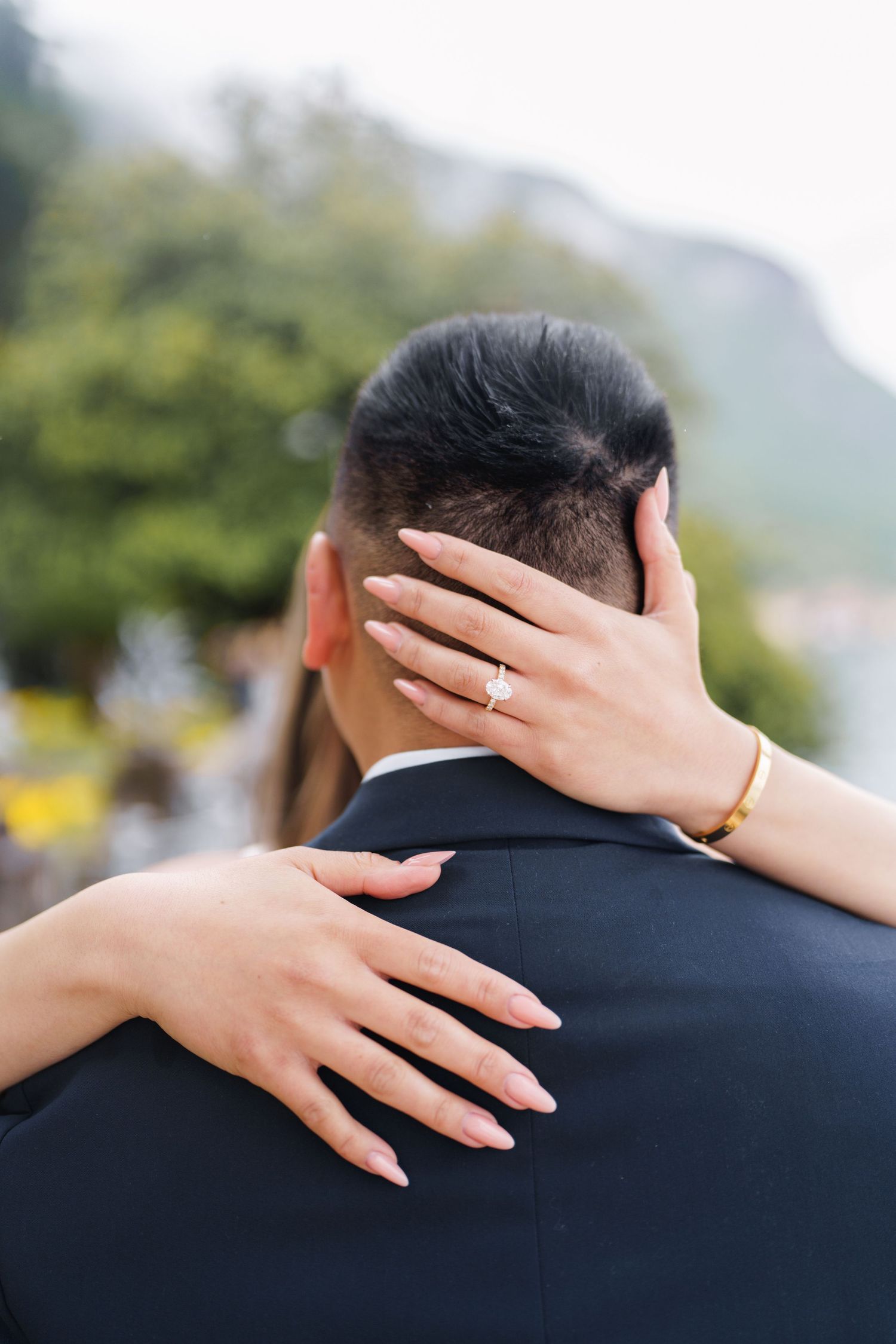 Lake Como proposal photographer capturing surprise engagement at Villa Monastero in Varenna