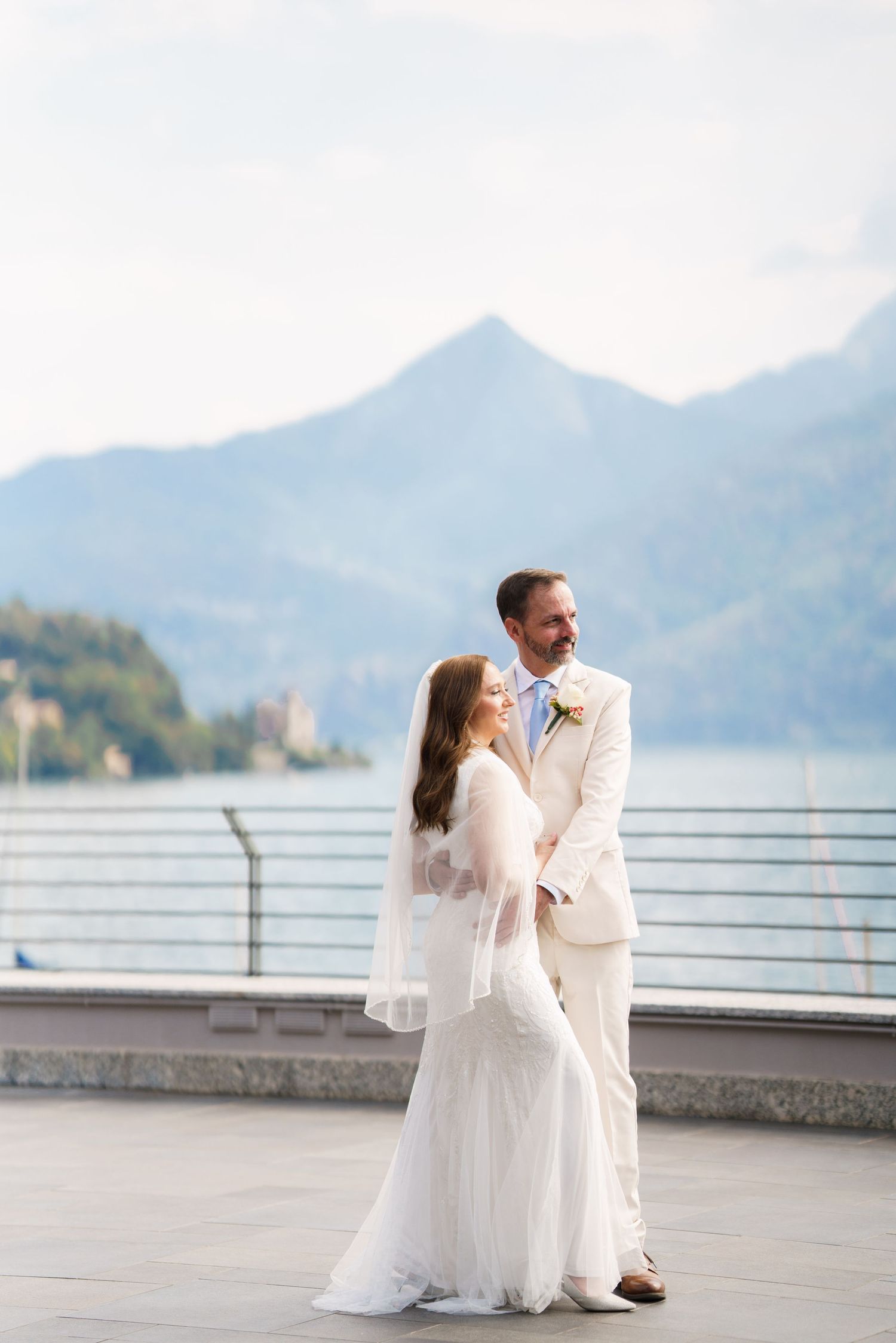 Newly married couple enjoying a quiet moment beside Lake Como
