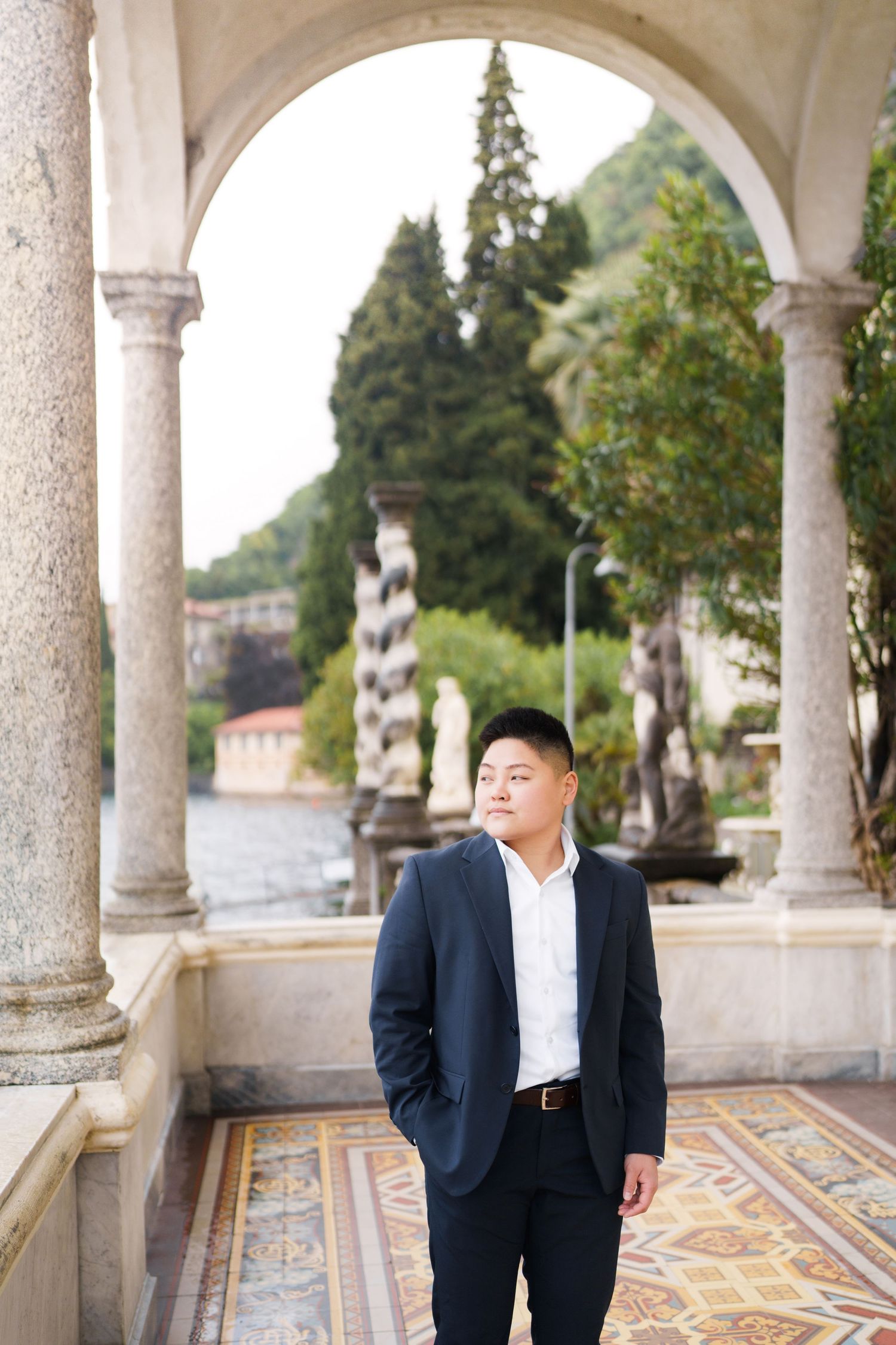 Lake Como proposal photographer capturing surprise engagement at Villa Monastero in Varenna