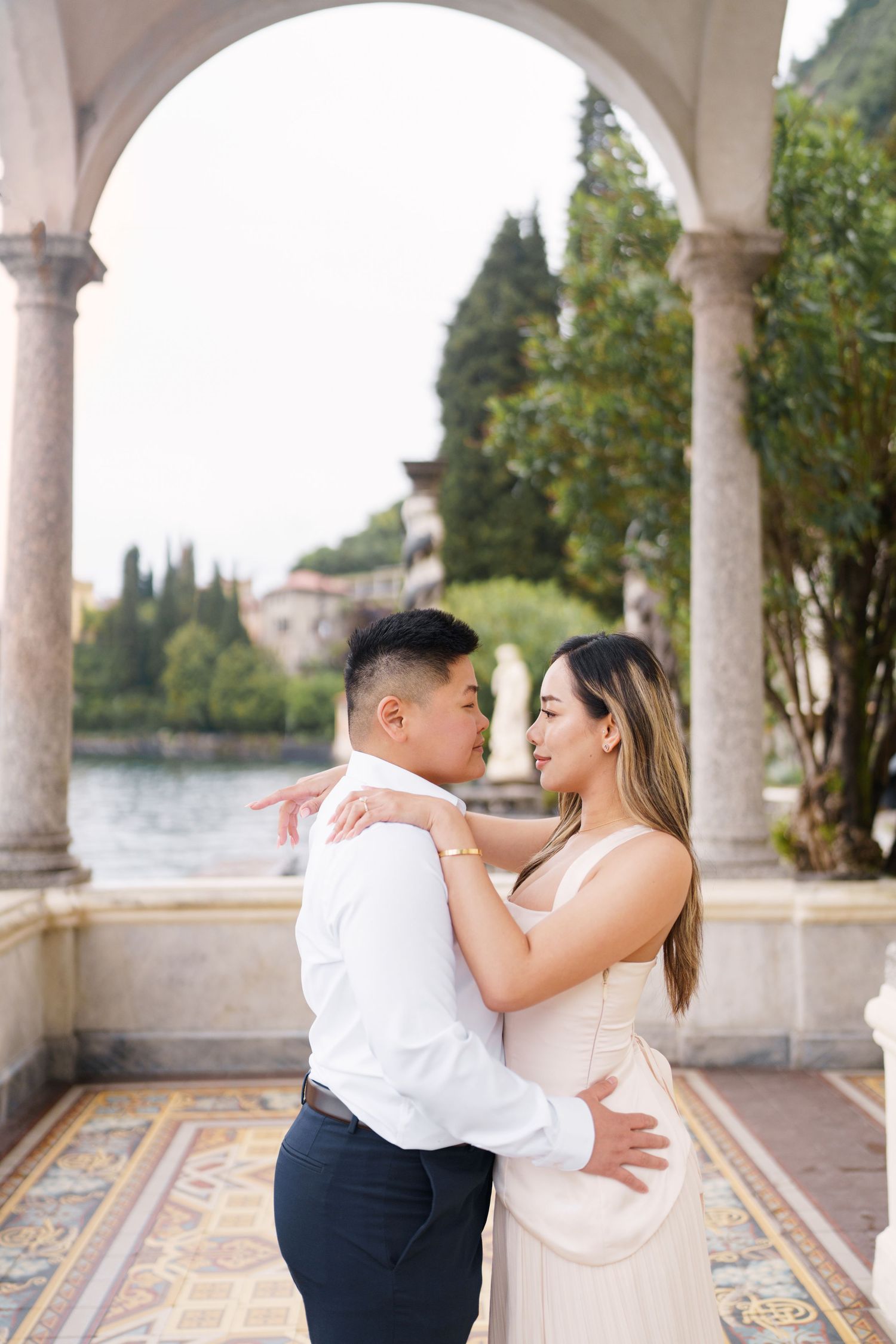 Lake Como proposal photographer capturing surprise engagement at Villa Monastero in Varenna