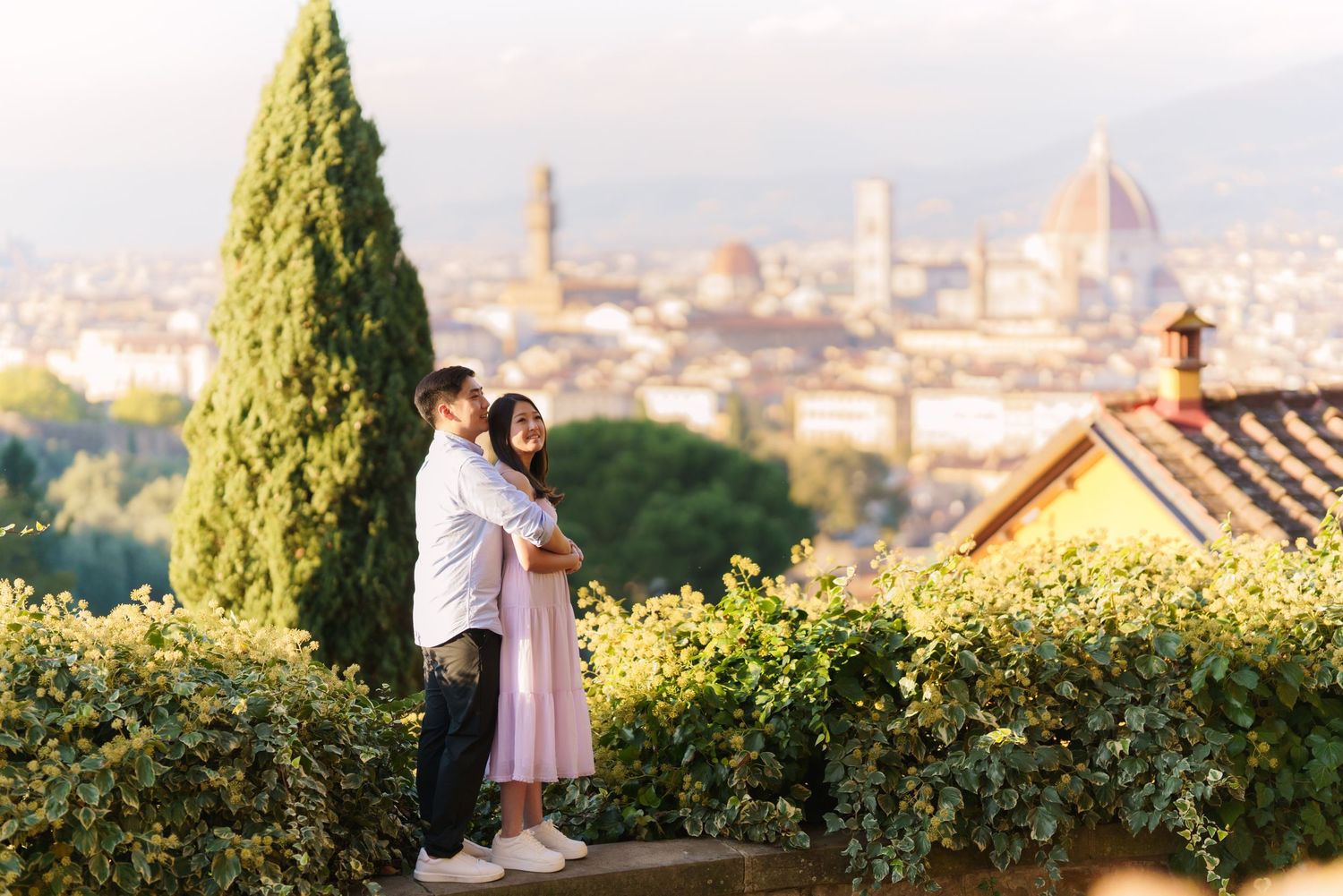 A series of photos showing a romantic sunset proposal overlooking Florence, Italy with the Duomo cathedral visible in distance.