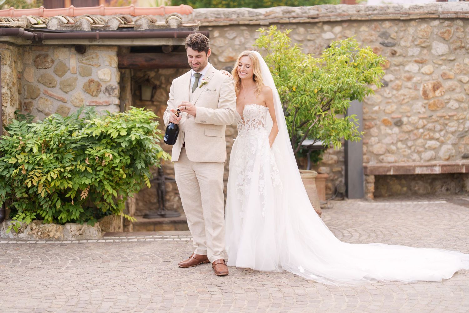 Wedding celebration photos on rustic stone steps with Mediterranean architectural details.