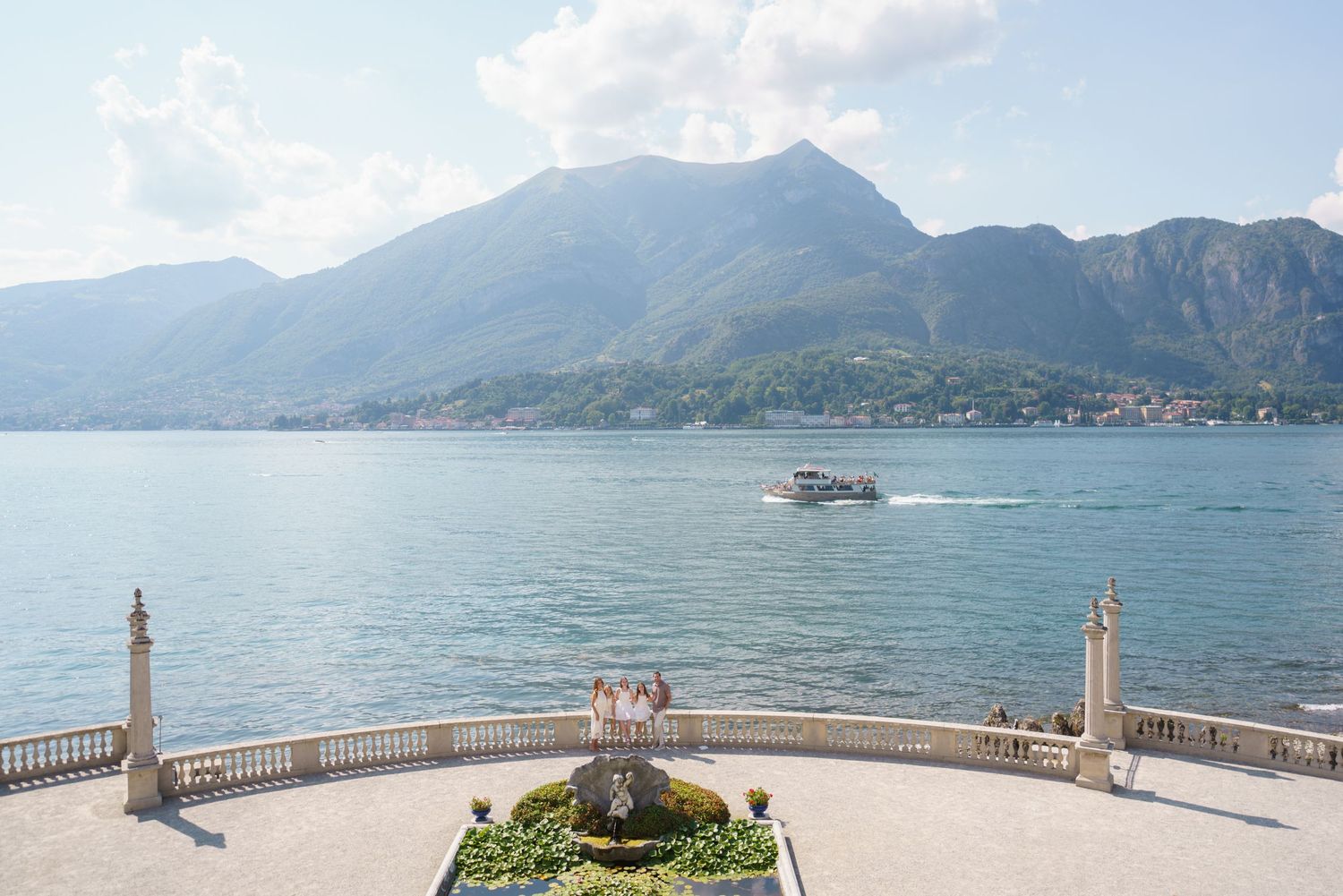 Family portrait at Villa Melzi with Lake Como mountains in Bellagio