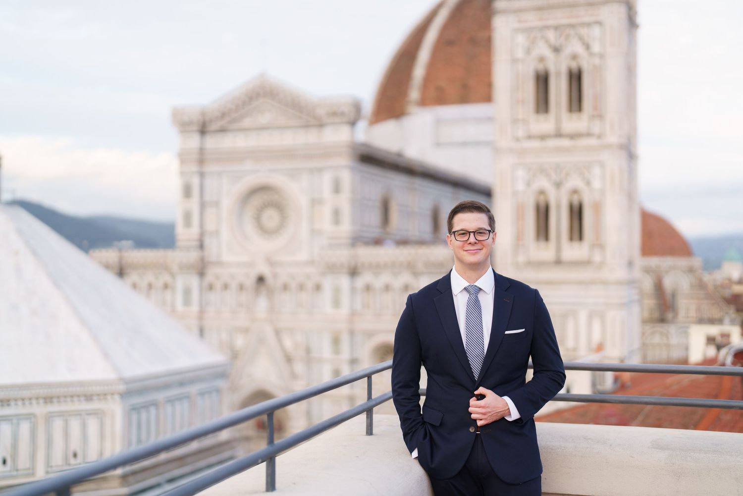 A series of wedding photos showing a cathedral facade and a groom in a dark suit posing on a rooftop terrace in Florence.