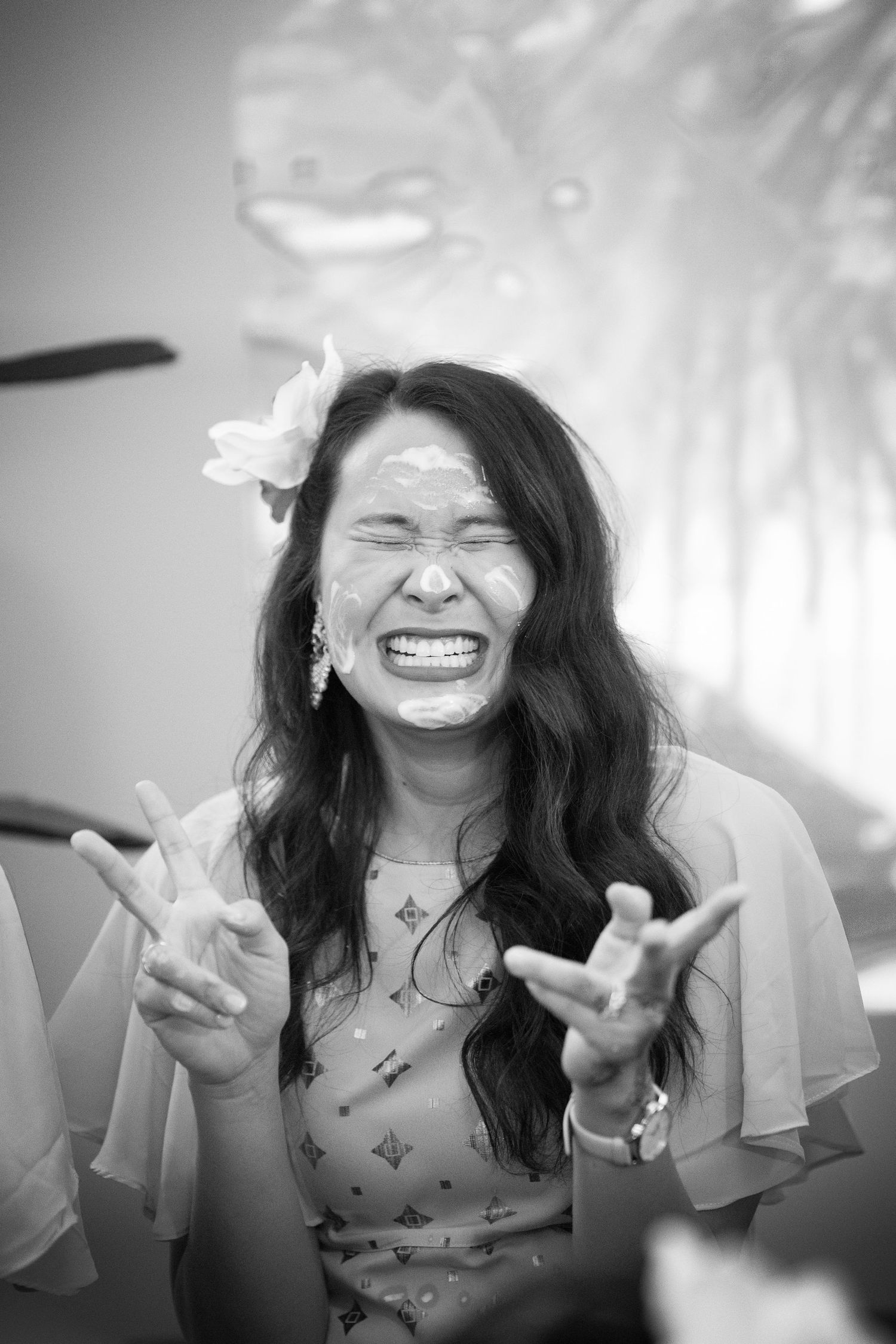 Black and white sequence showing expressions of pure joy and laughter during a celebration.