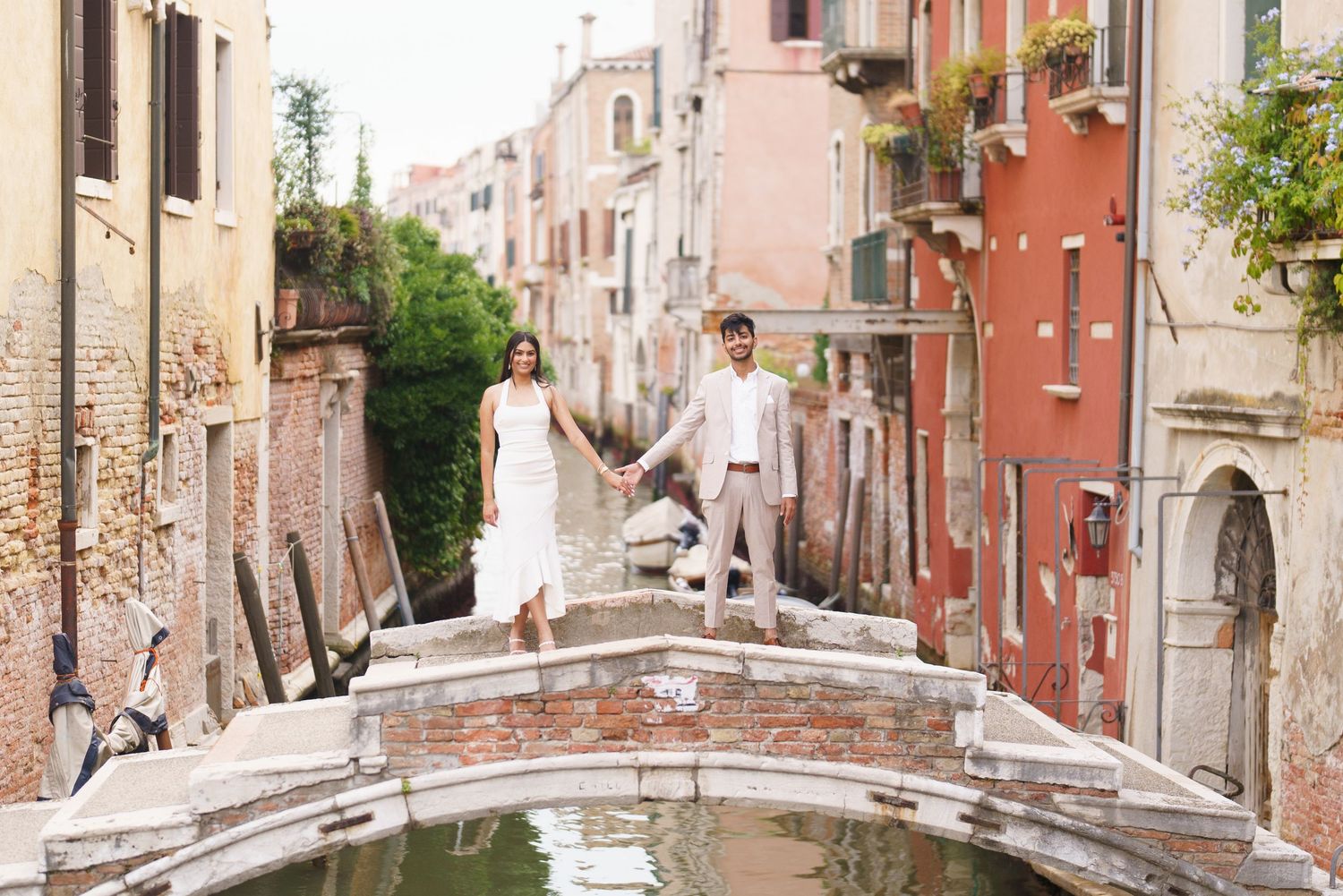 Panoramic view of colorful Mediterranean buildings and narrow streets in a charming Italian coastal town.