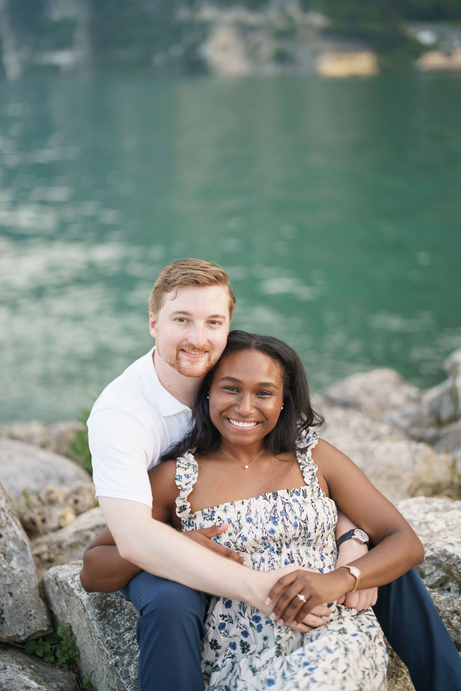 Couple portrait by Lake Garda surrounded by mountains in Riva del Garda, Italy