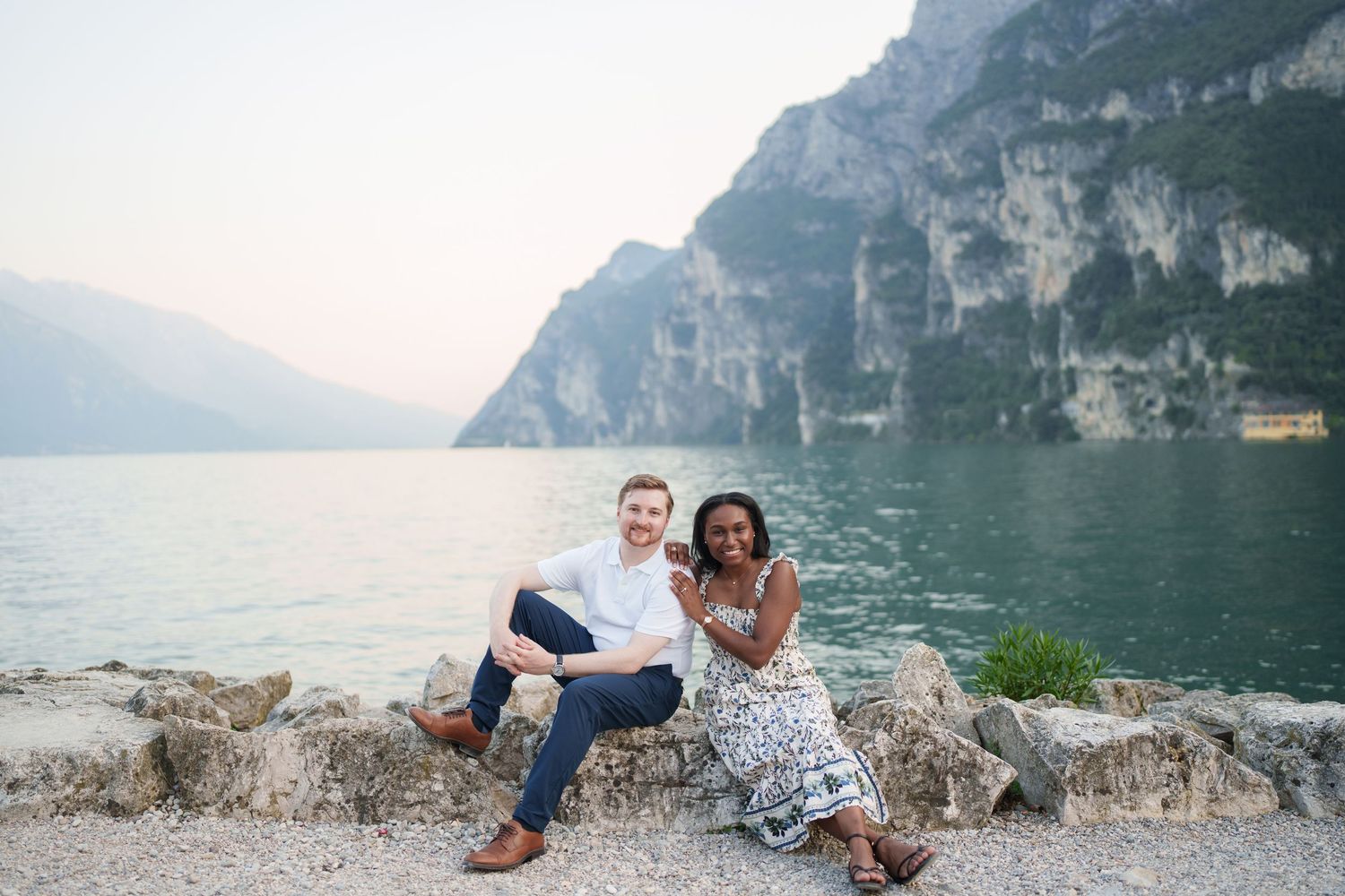 Emotional reaction during a surprise proposal beside Lake Garda in Riva del Garda