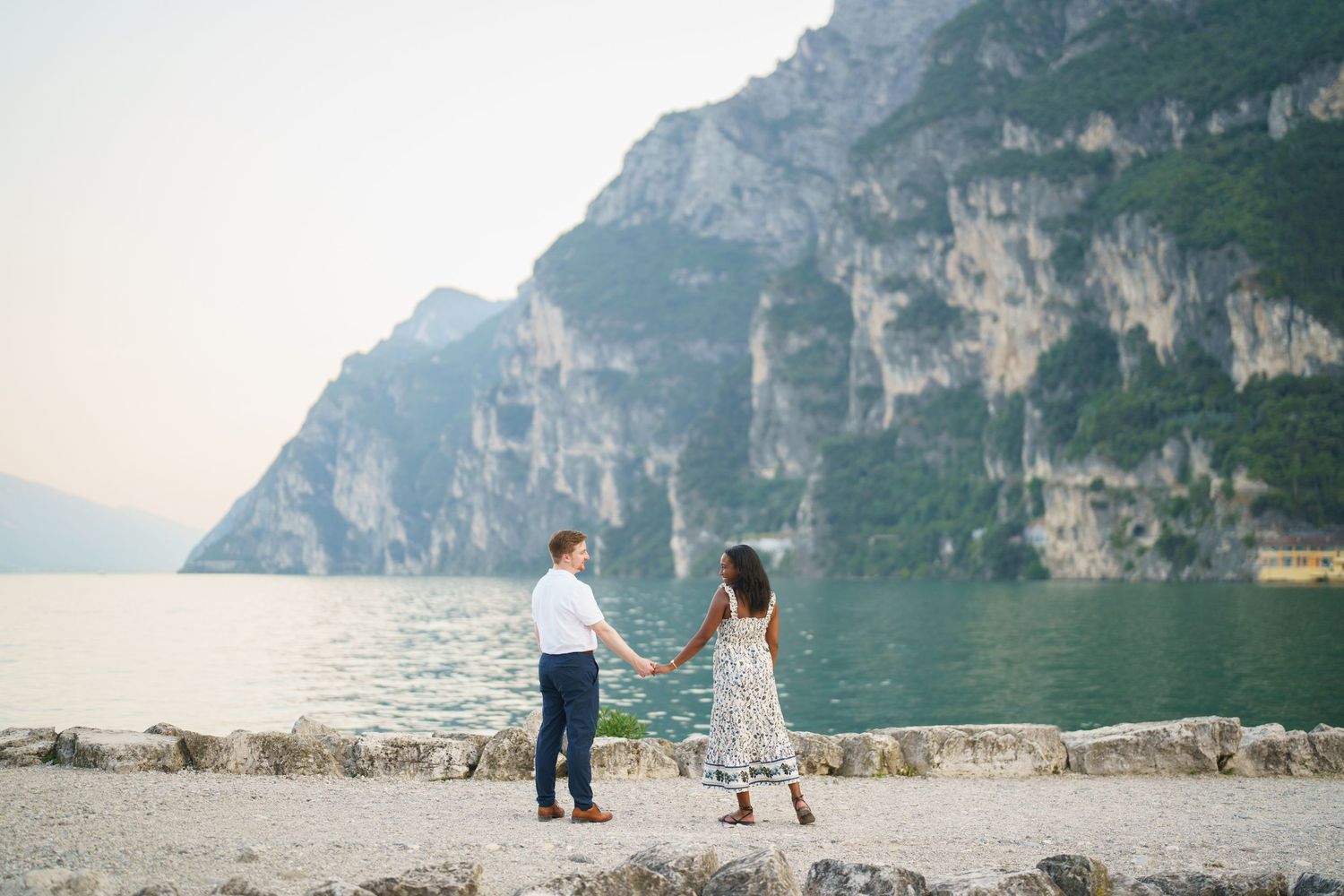 Emotional reaction during a surprise proposal beside Lake Garda in Riva del Garda