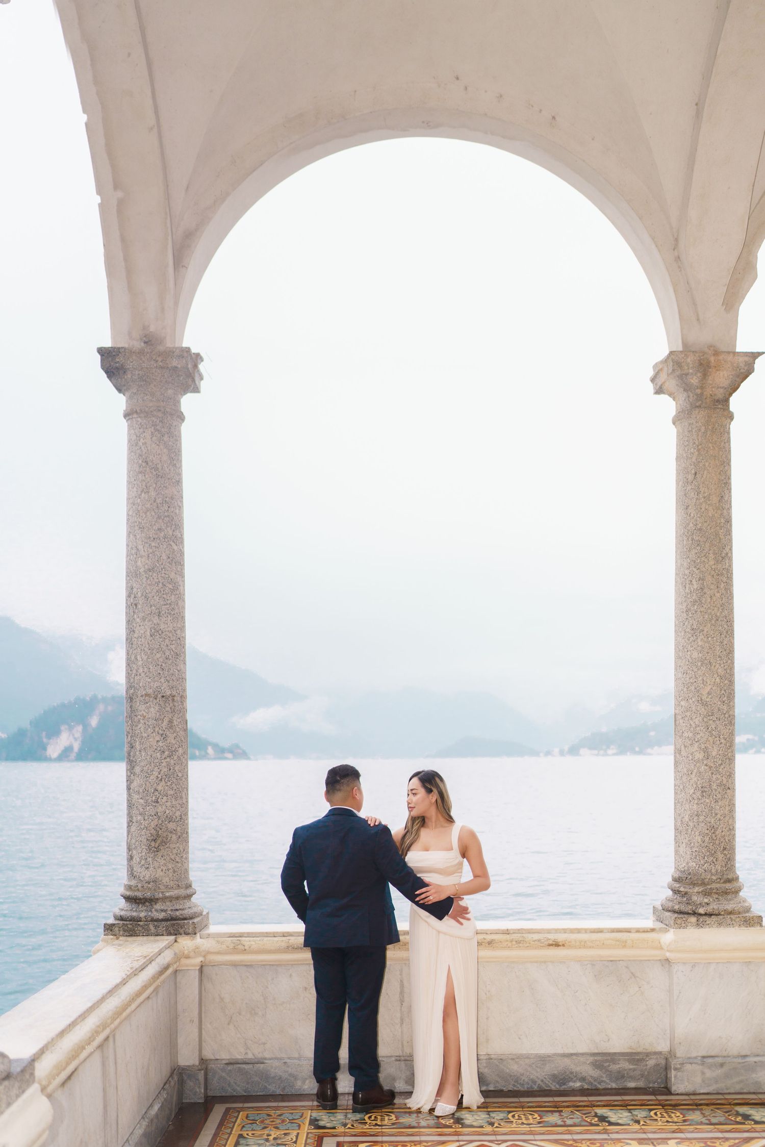 Lake Como proposal photographer capturing surprise engagement at Villa Monastero in Varenna