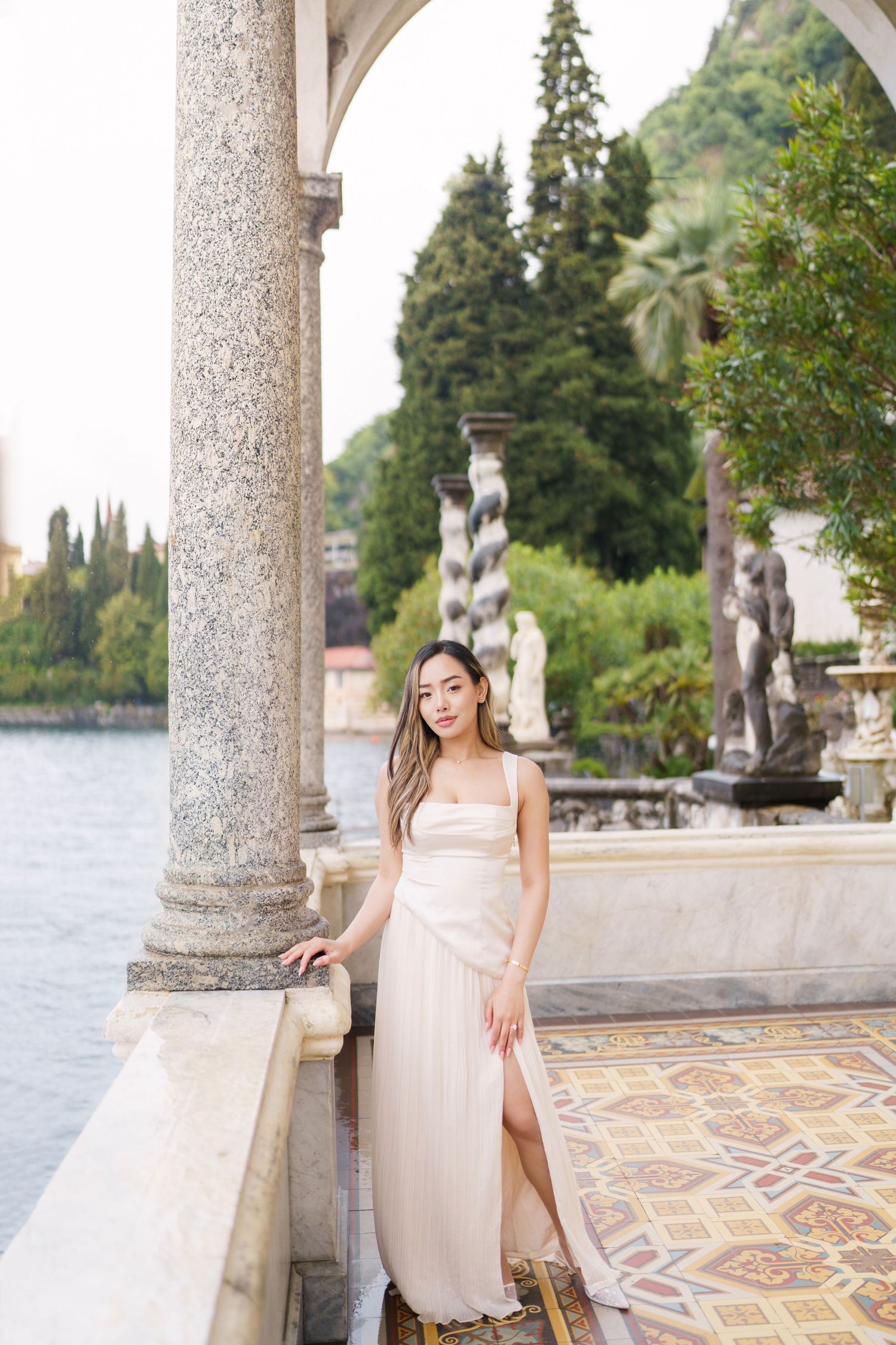 Lake Como proposal photographer capturing surprise engagement at Villa Monastero in Varenna
