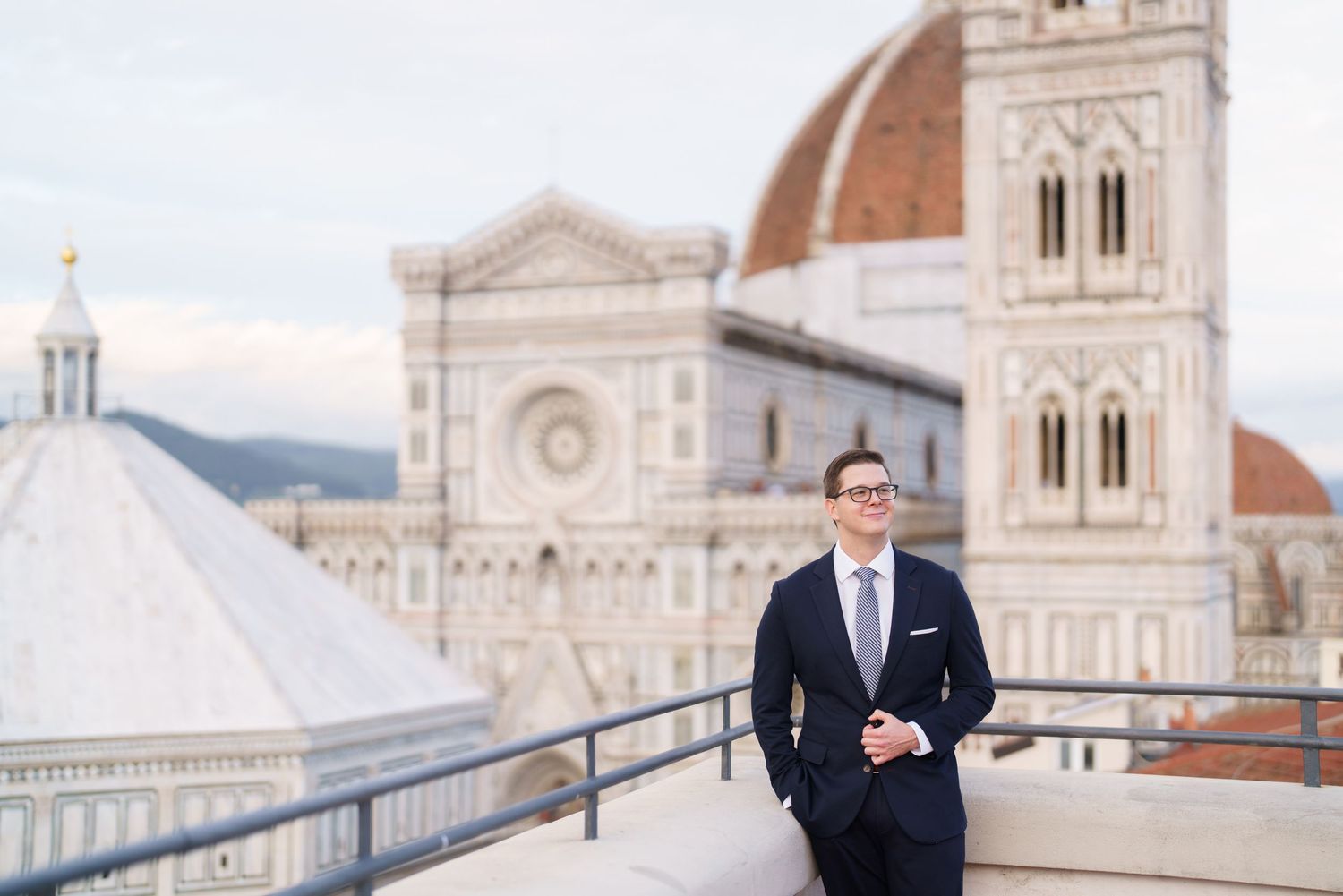 Professional portrait session with Florence Cathedral and historic architecture of Florence, Italy in the background.