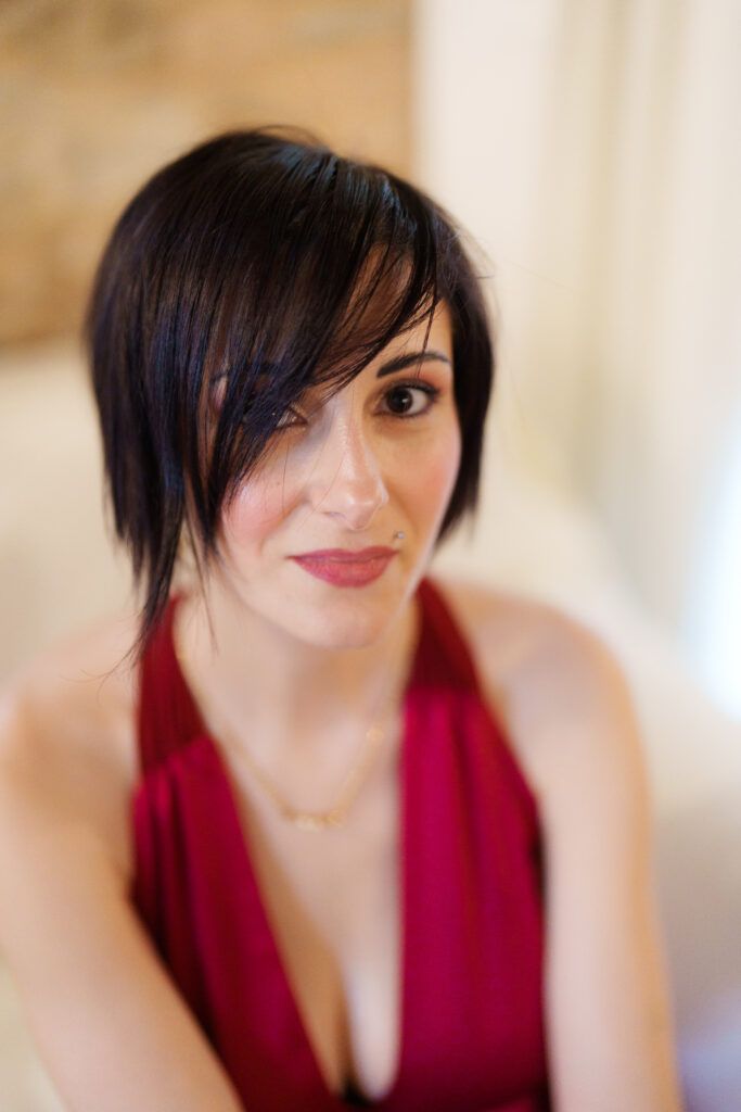 Series of close-up portraits showing someone in a deep red halter dress.