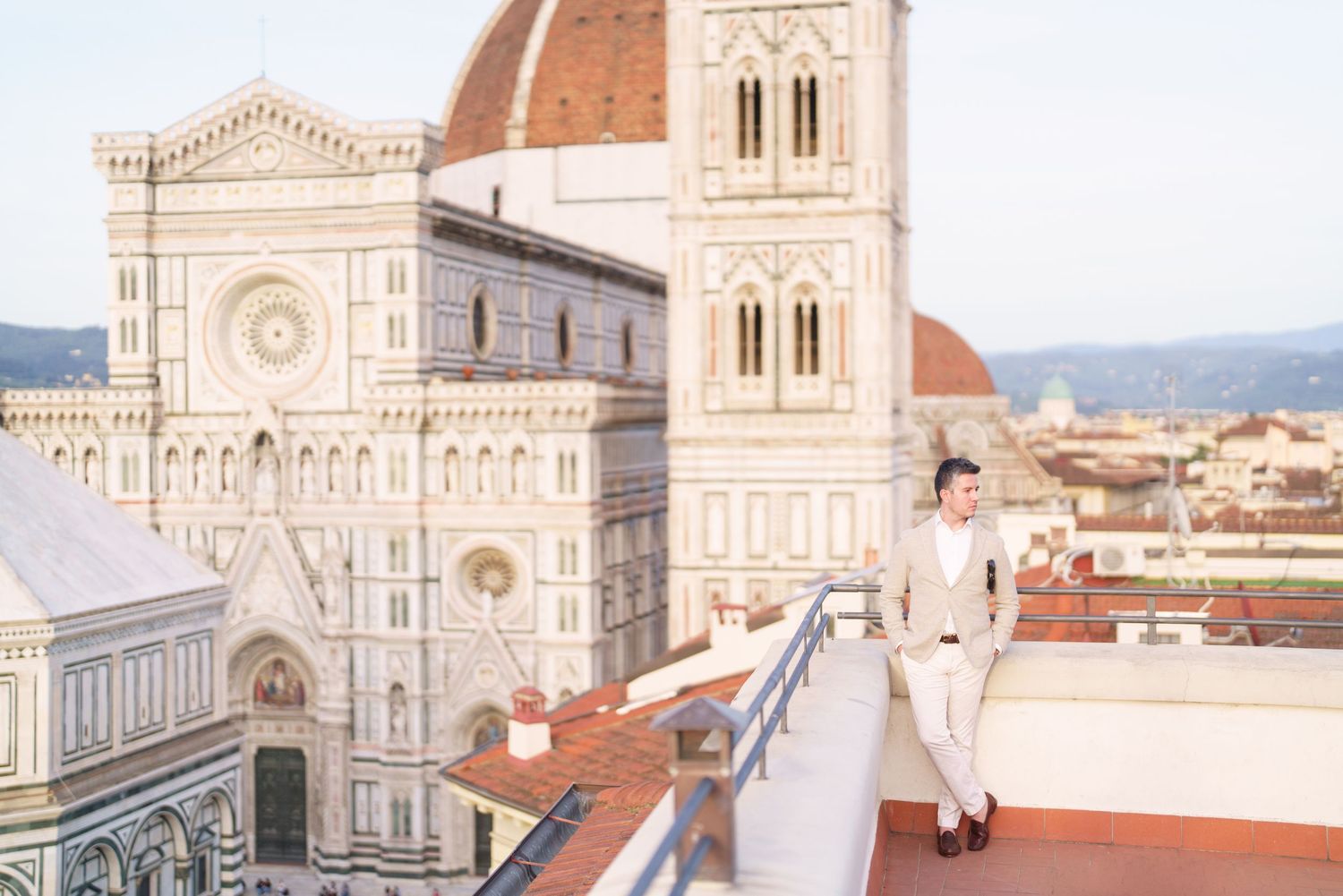 The iconic Florence Cathedral with its red-tiled dome rises majestically above the historic Italian cityscape.