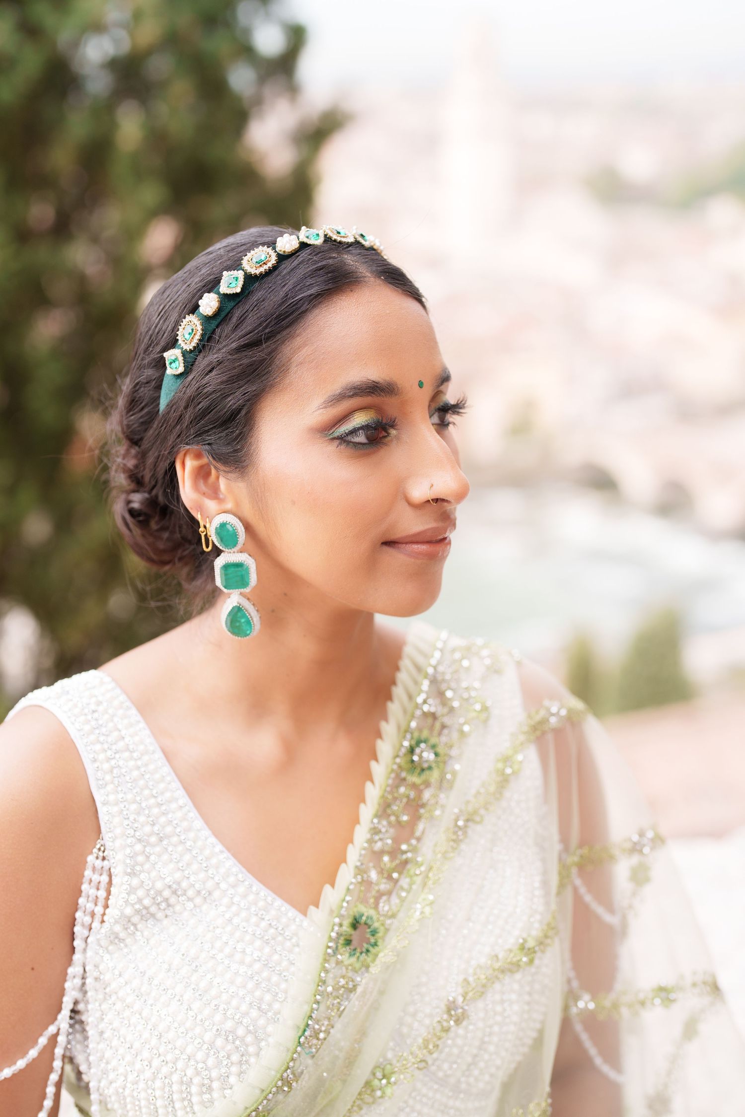 photographer verona A woman in traditional Indian attire wears turquoise jewelry and white lace in a series of profile portraits.