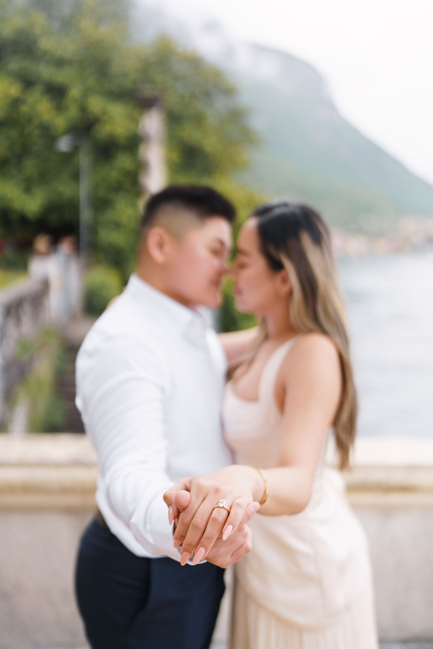 Lake Como proposal photographer capturing surprise engagement at Villa Monastero in Varenna