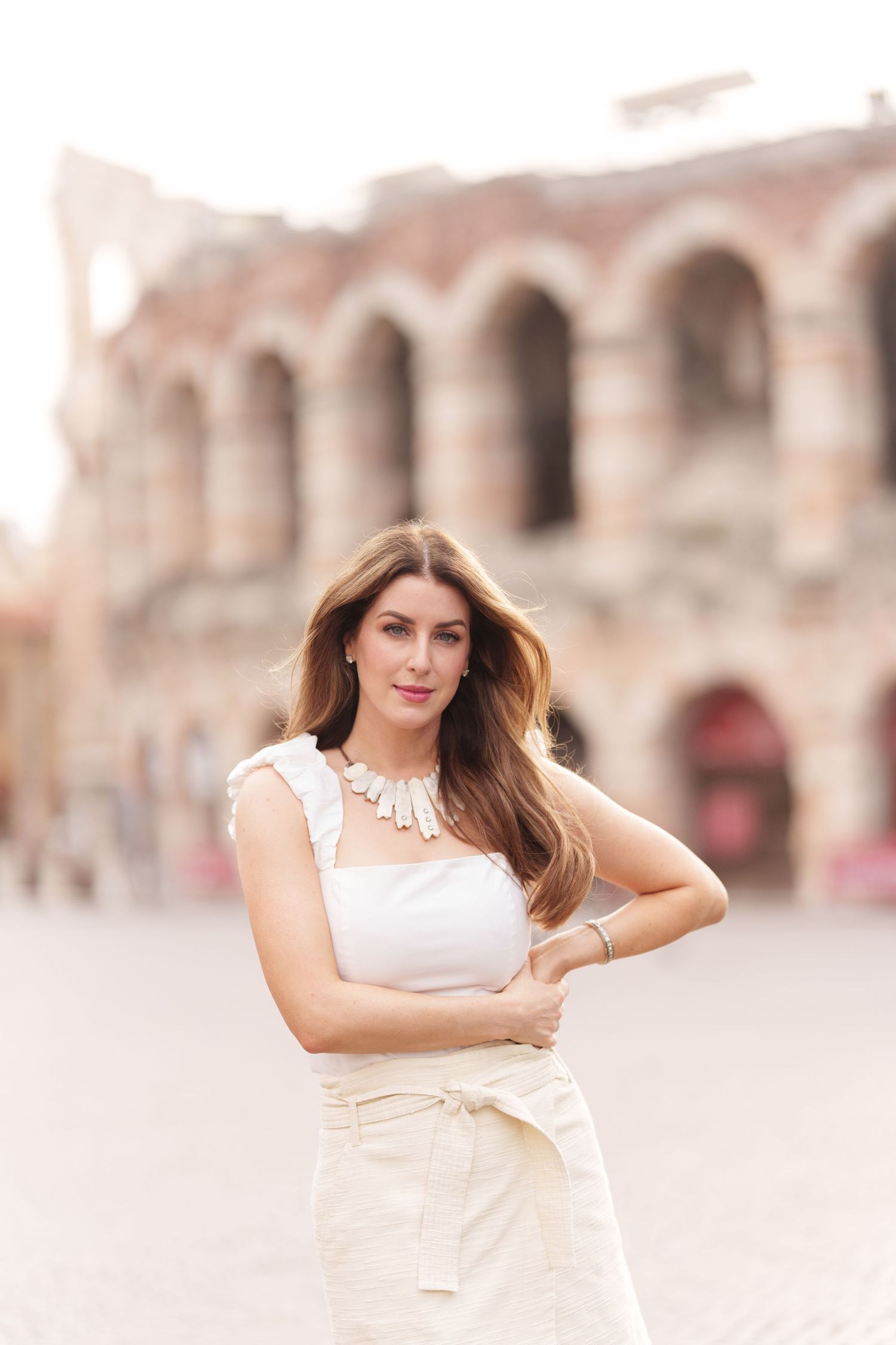 Verona family photographer family walking in front of Verona Arena Italy