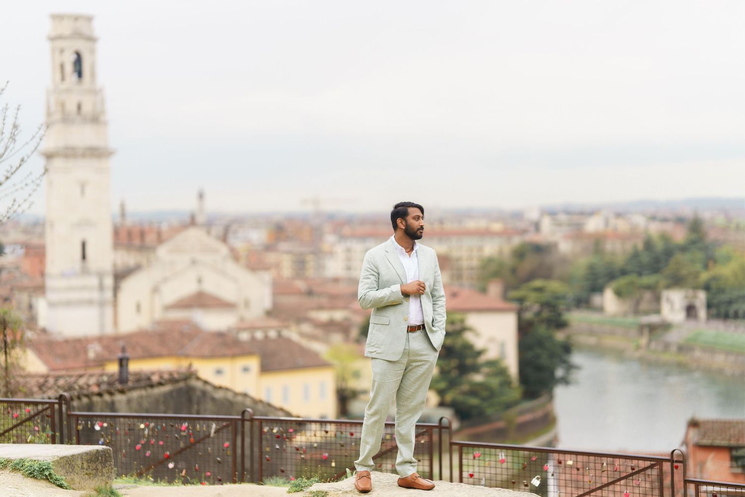 A scenic view of Florence, Italy with historic architecture and the Arno River visible in the distance.