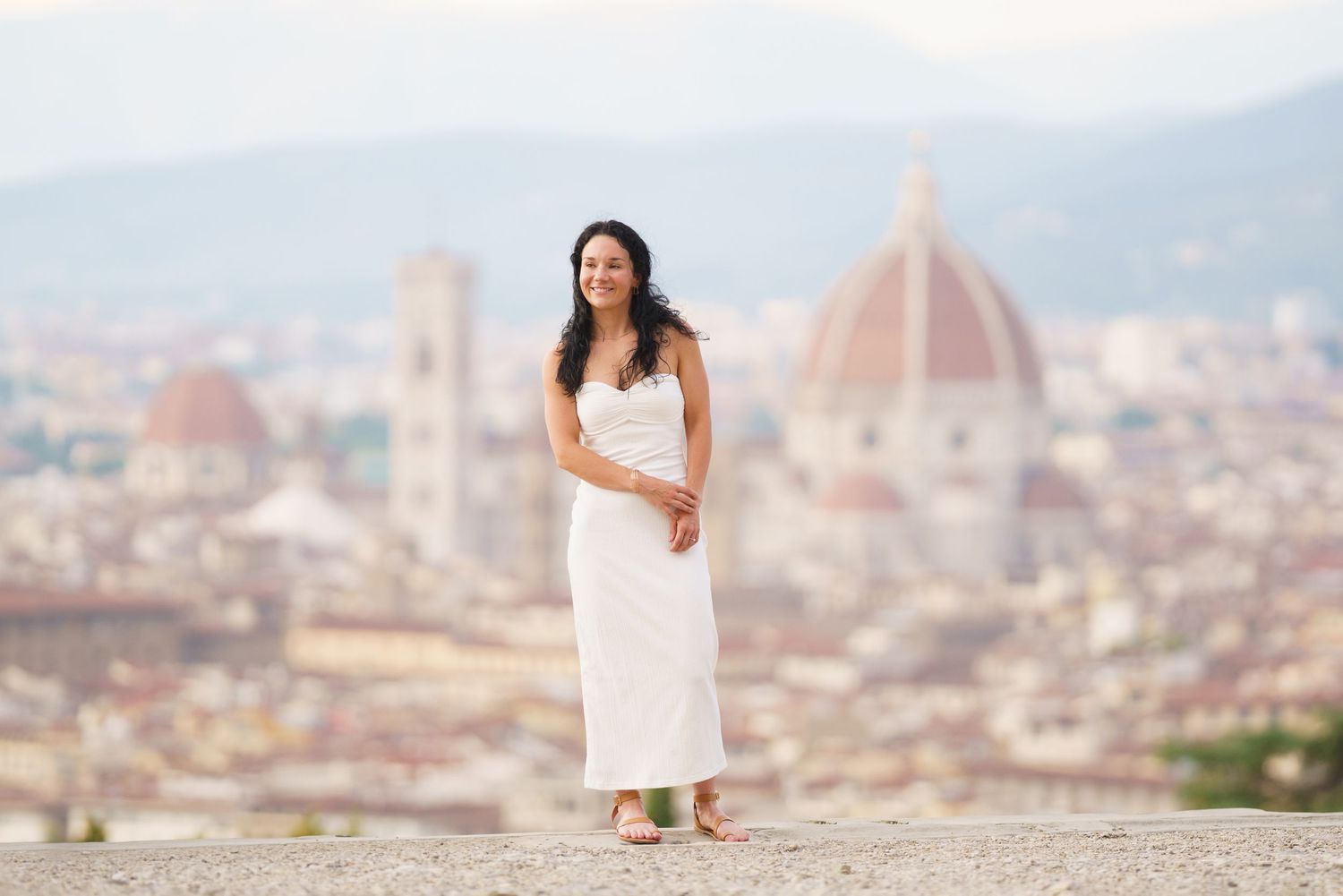 Scenic panoramic view of Florence, Italy with the iconic Duomo cathedral dome rising above the cityscape.