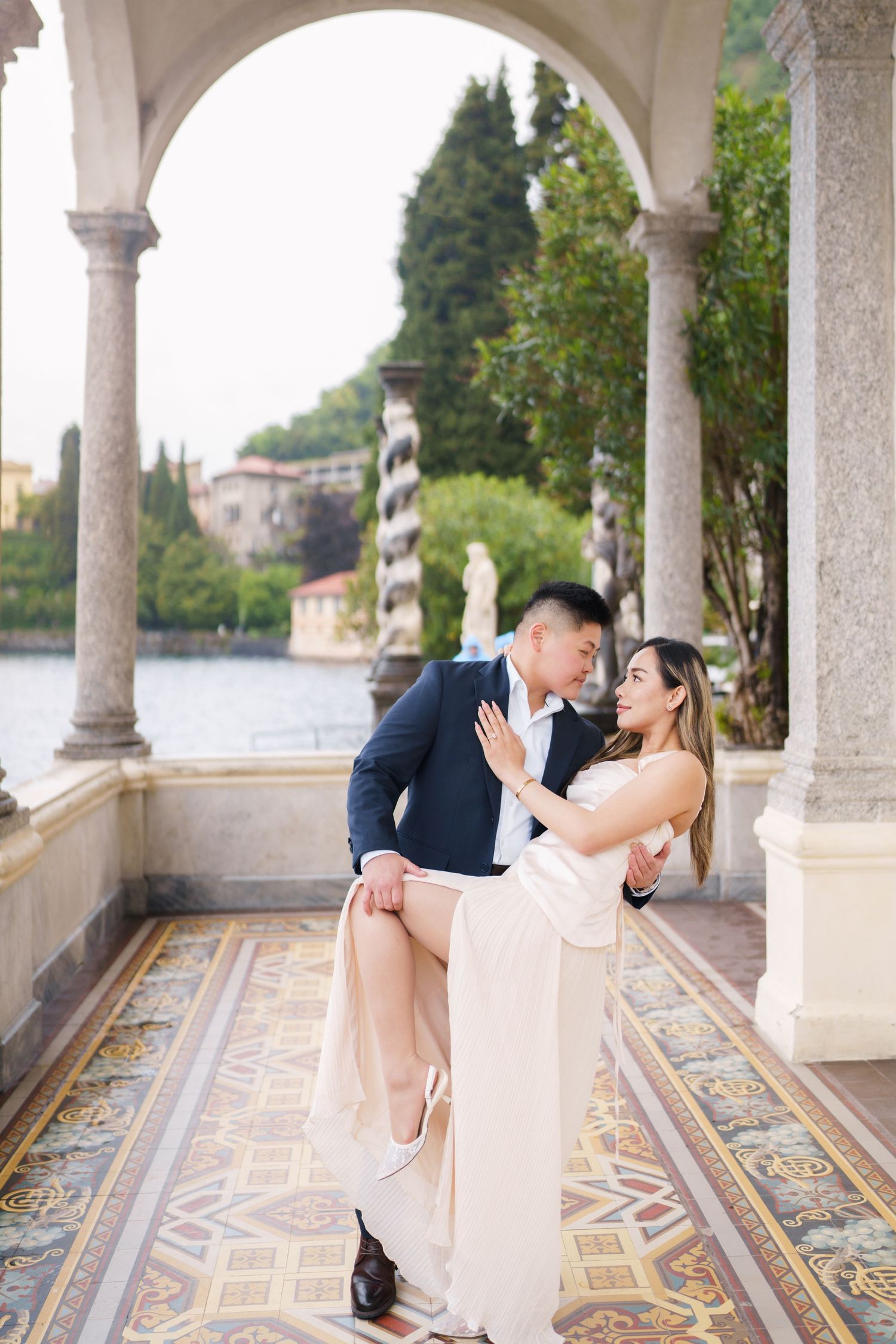 Lake Como proposal photographer capturing surprise engagement at Villa Monastero in Varenna