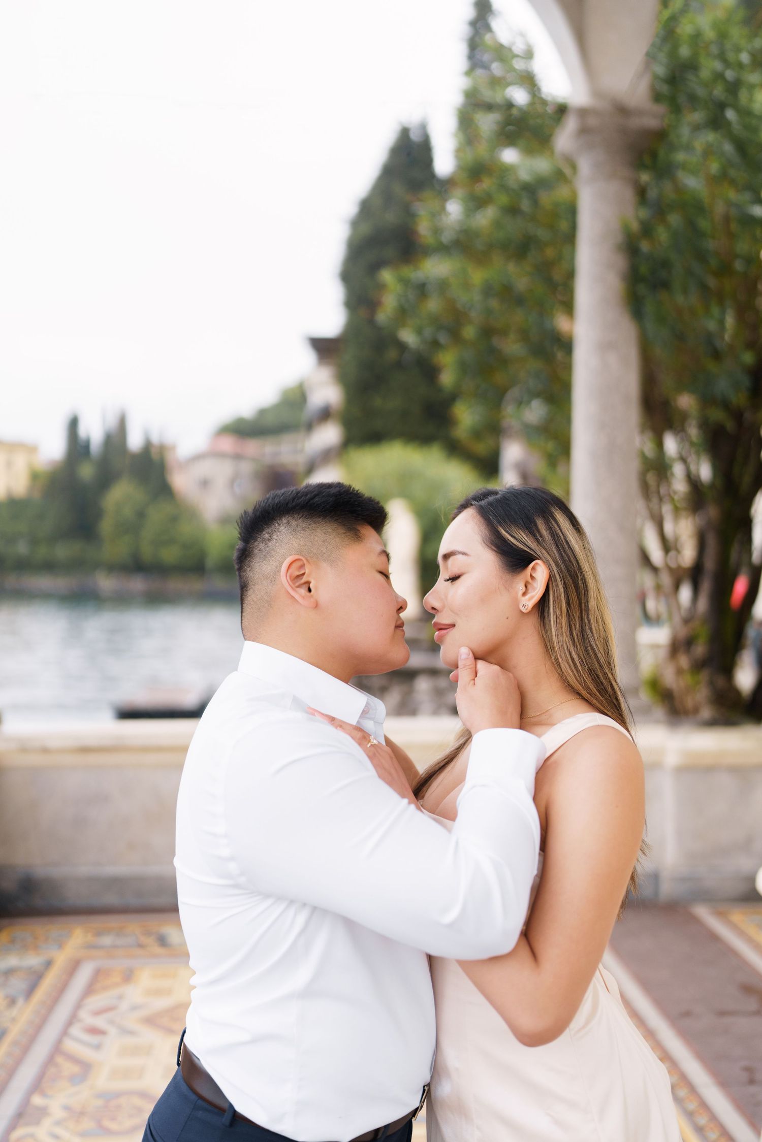 Lake Como proposal photographer capturing surprise engagement at Villa Monastero in Varenna