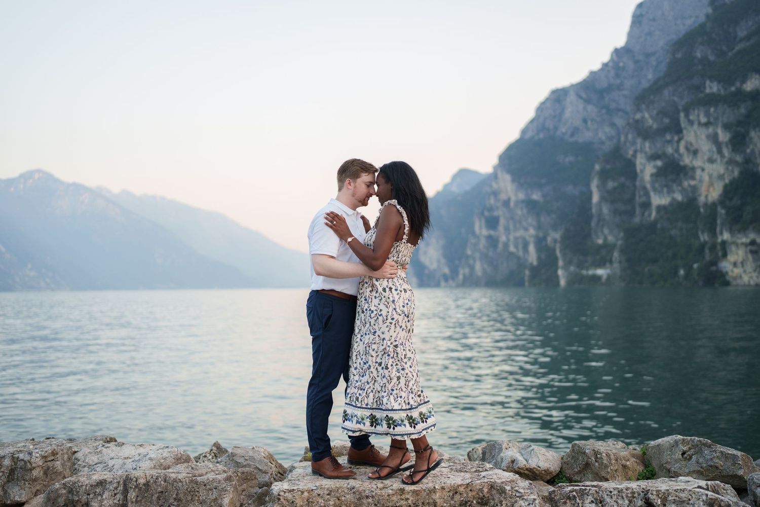 Emotional reaction during a surprise proposal beside Lake Garda in Riva del Garda