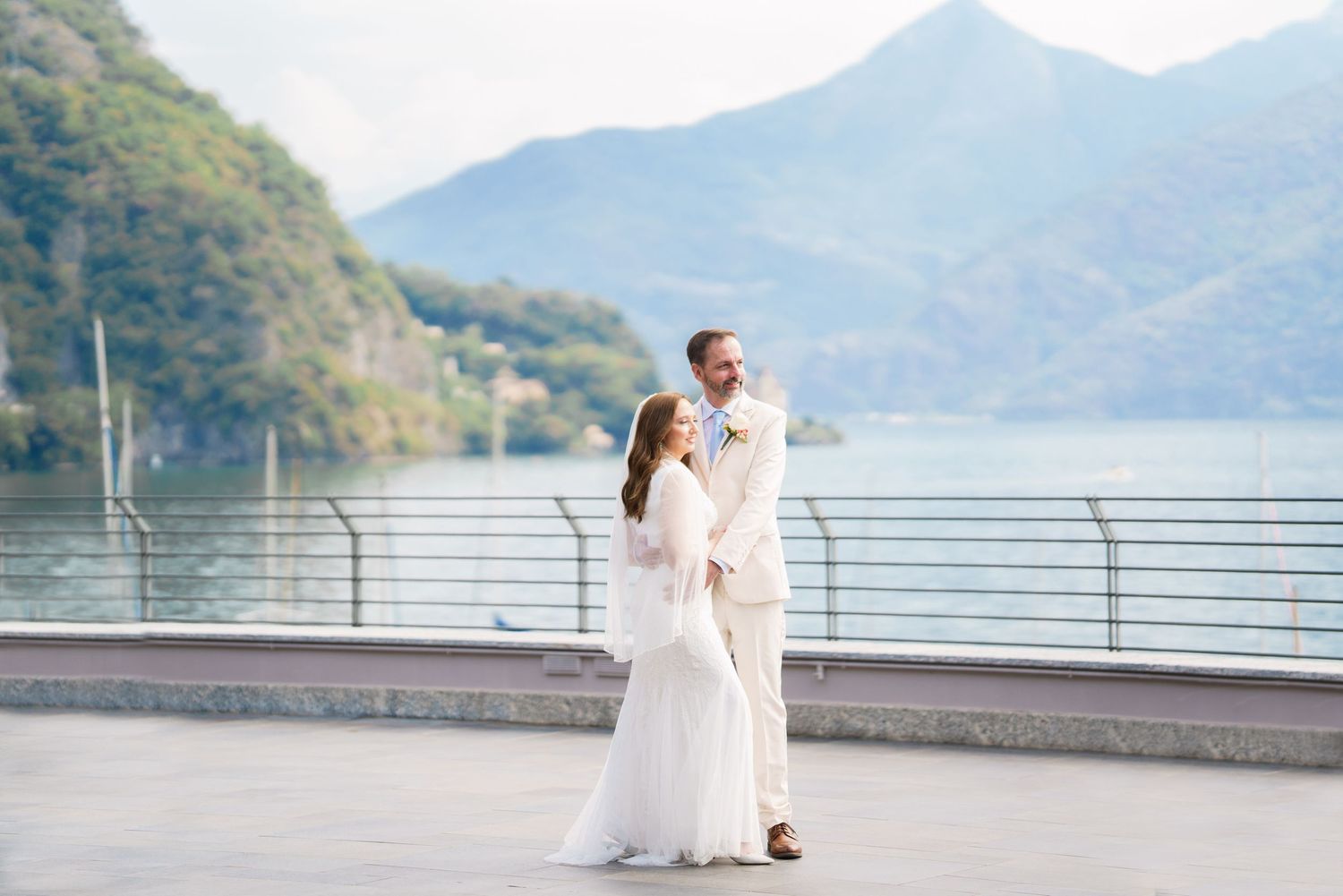 Newly married couple enjoying a quiet moment beside Lake Como