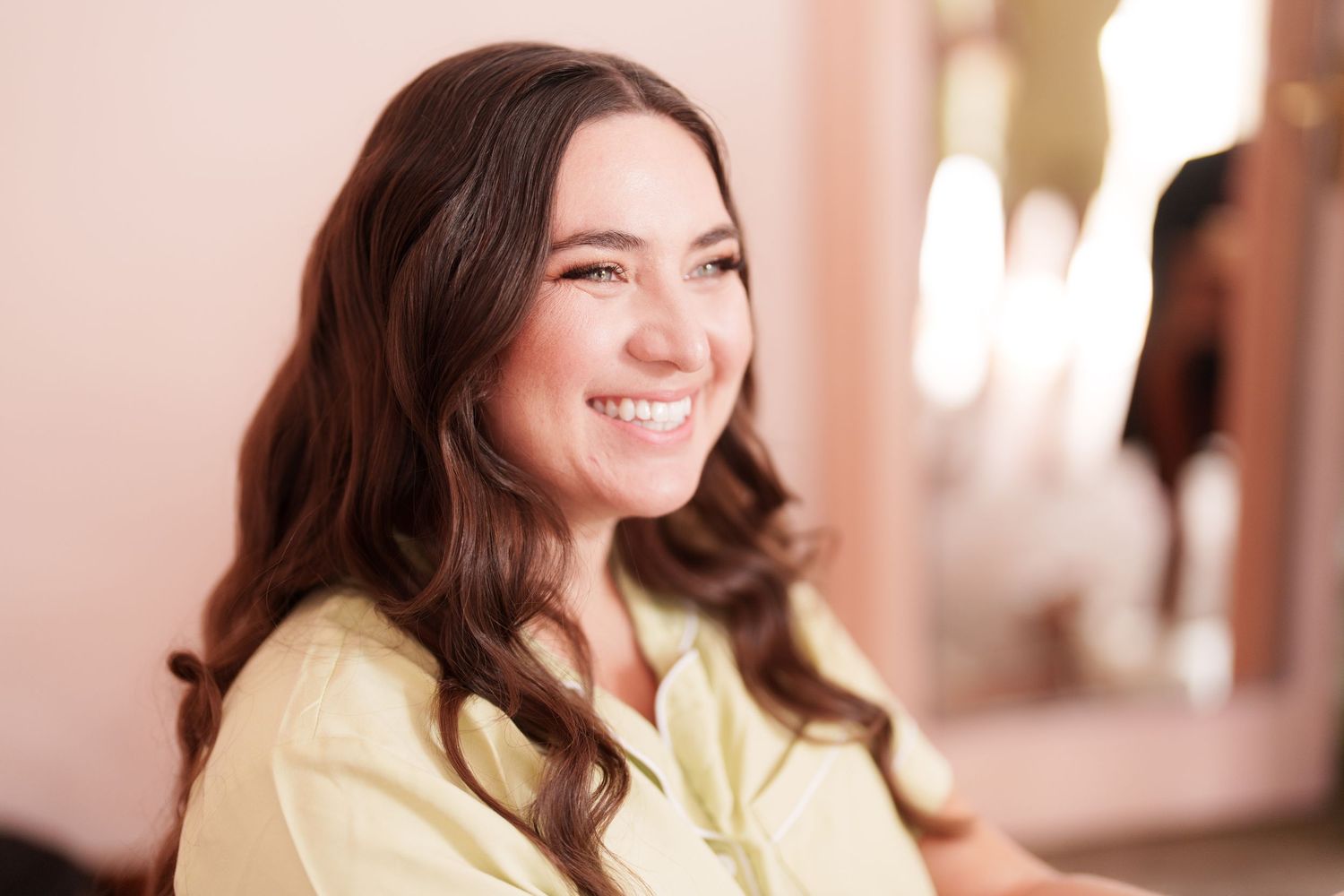 Casual lifestyle photos showing relaxed poses and natural smiles in a bedroom setting.