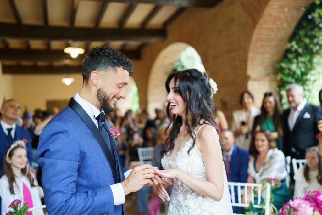 Elegant indoor wedding venue with exposed beams and natural lighting.