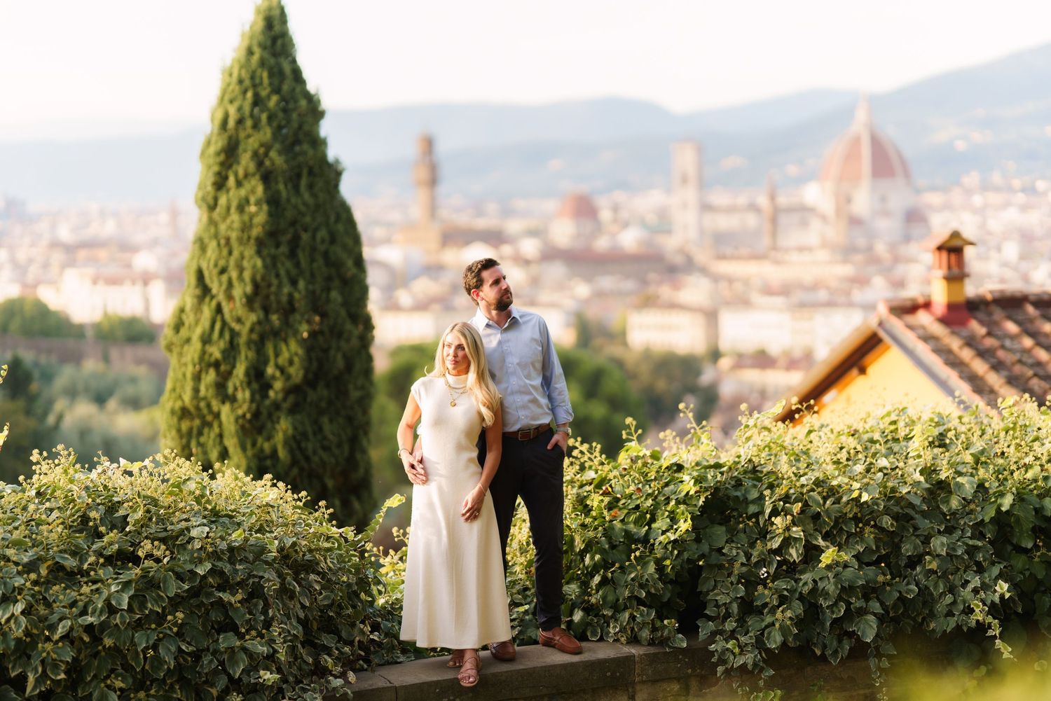 Scenic view of Florence, Italy with historic domed cathedral and city skyline visible from hilltop garden terrace.
