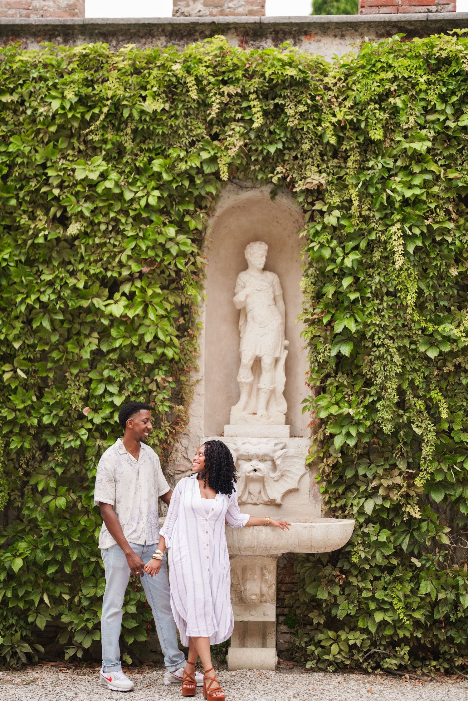 Proposal engagement photographer Verona capturing emotional couple portraits in historic Italian gardens