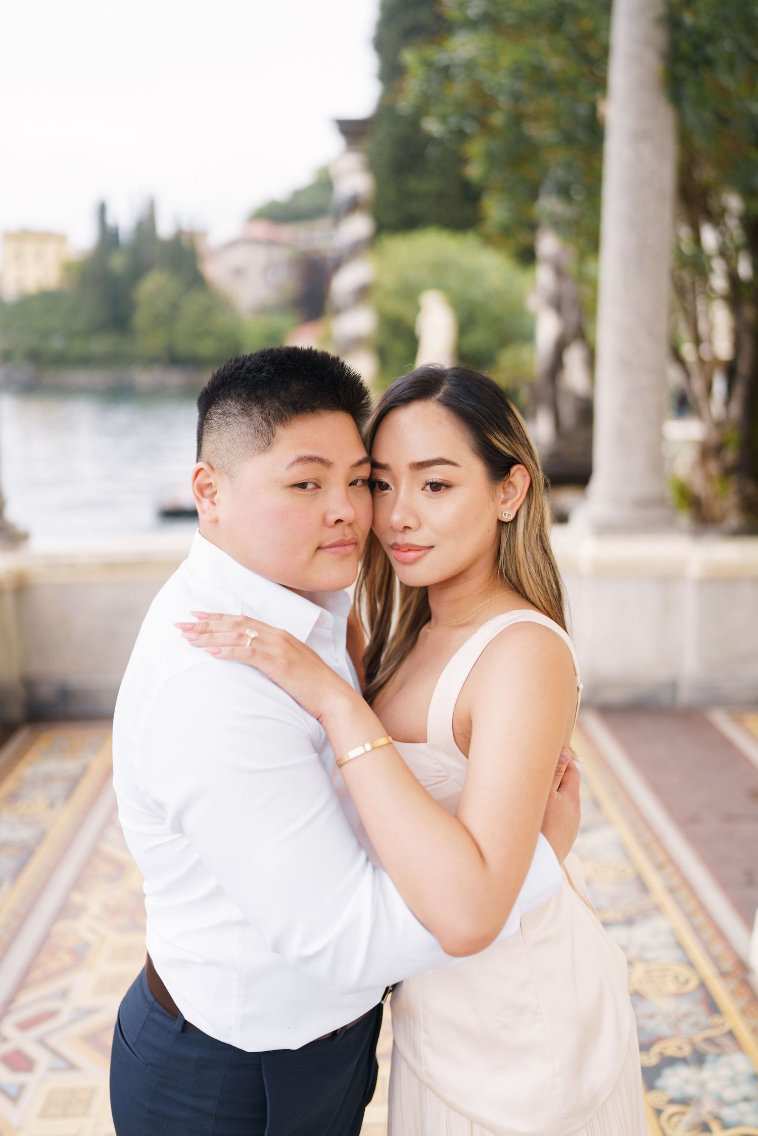 Lake Como proposal photographer capturing surprise engagement at Villa Monastero in Varenna