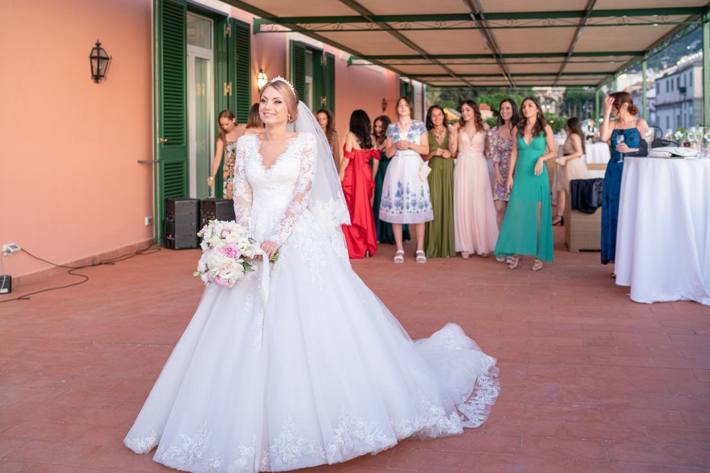 Wedding celebration in covered outdoor terrace venue.