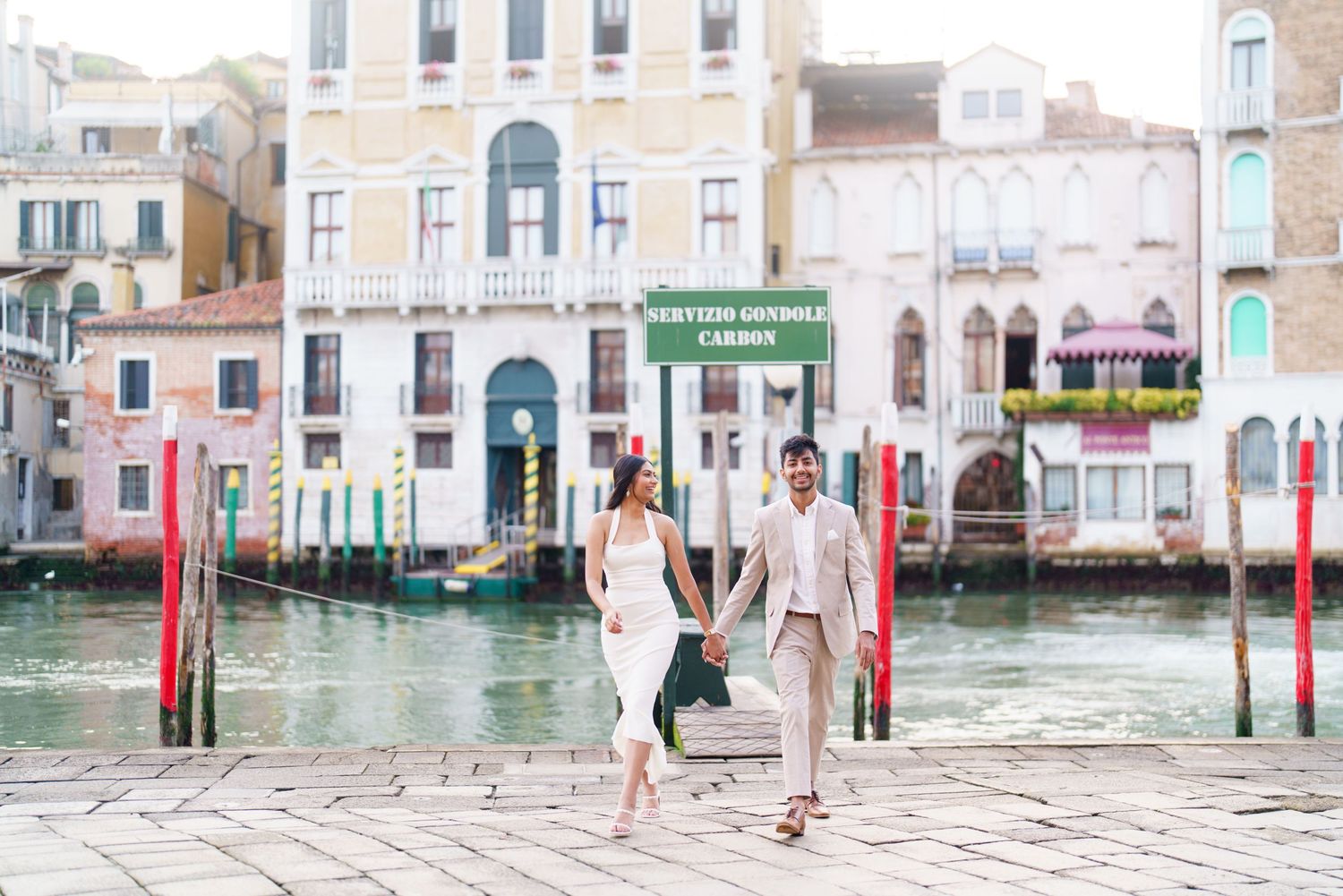 A sequence of five photos showing Venice's canals and buildings during high tide flooding with people walking on raised platforms.