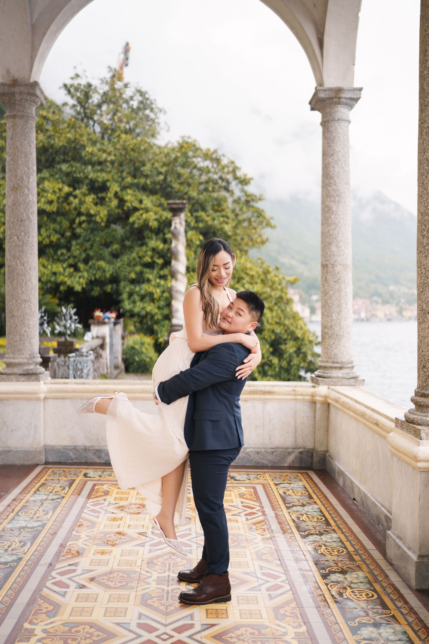 Lake Como proposal photographer capturing surprise engagement at Villa Monastero in Varenna