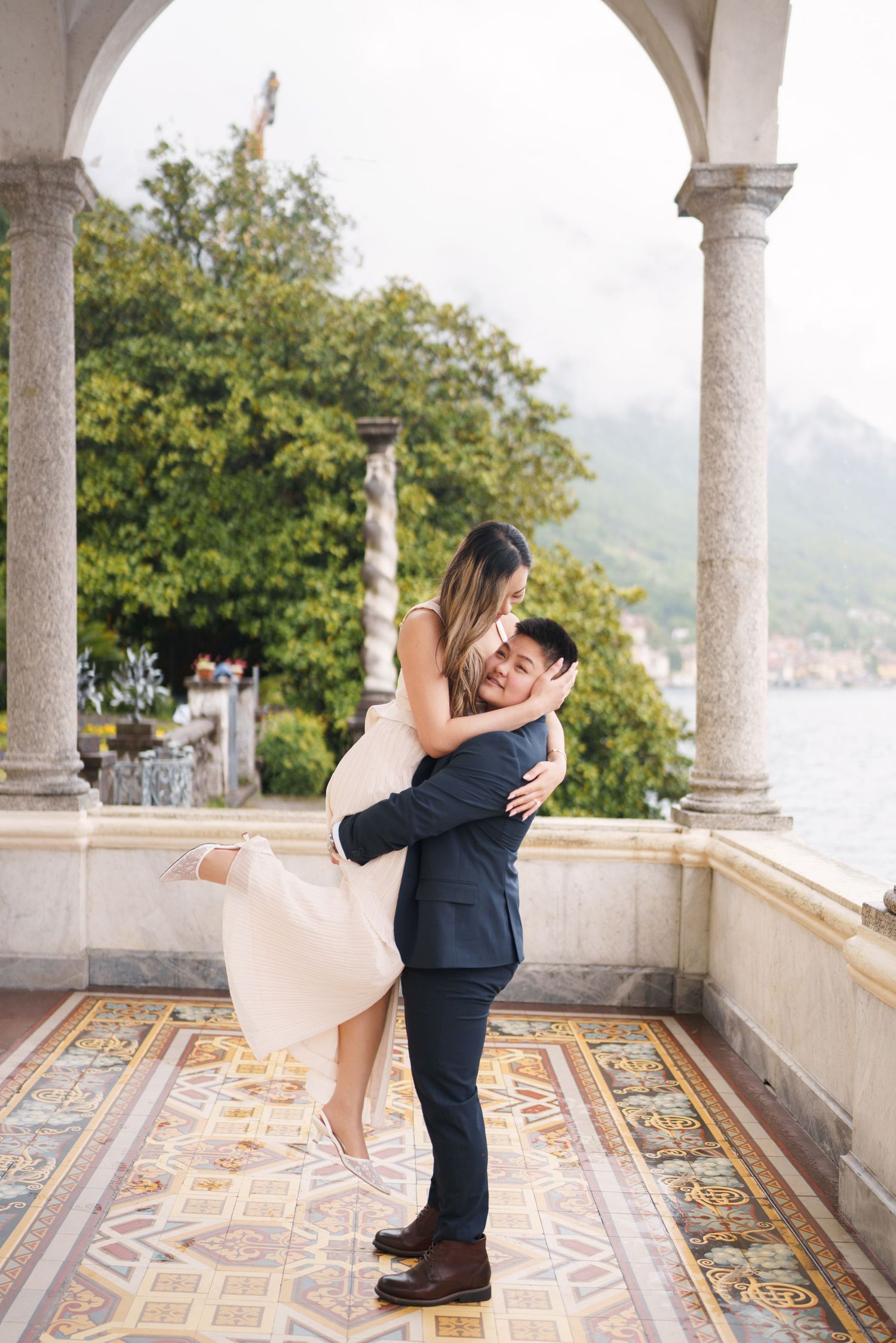 Lake Como proposal photographer capturing surprise engagement at Villa Monastero in Varenna