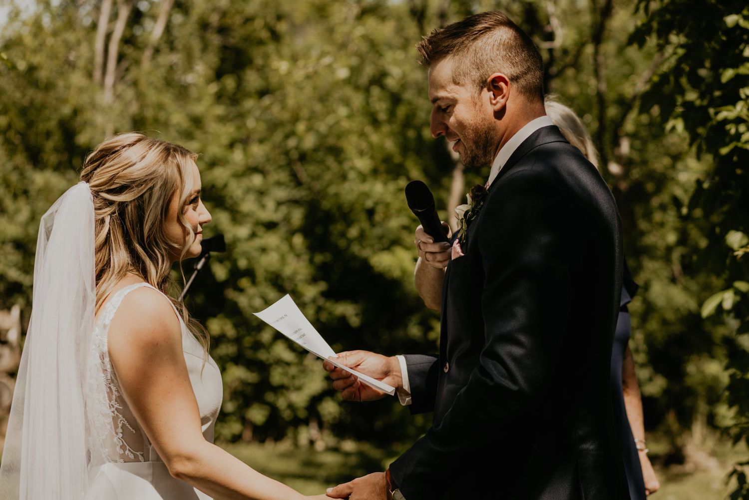 Couple exchanging vows during an intimate outdoor garden wedding ceremony.
