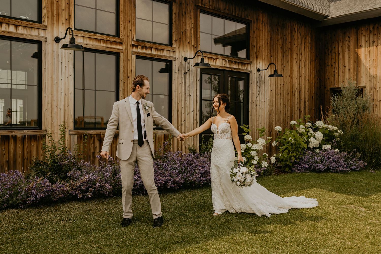 A silhouette through a window shows a romantic wedding moment.