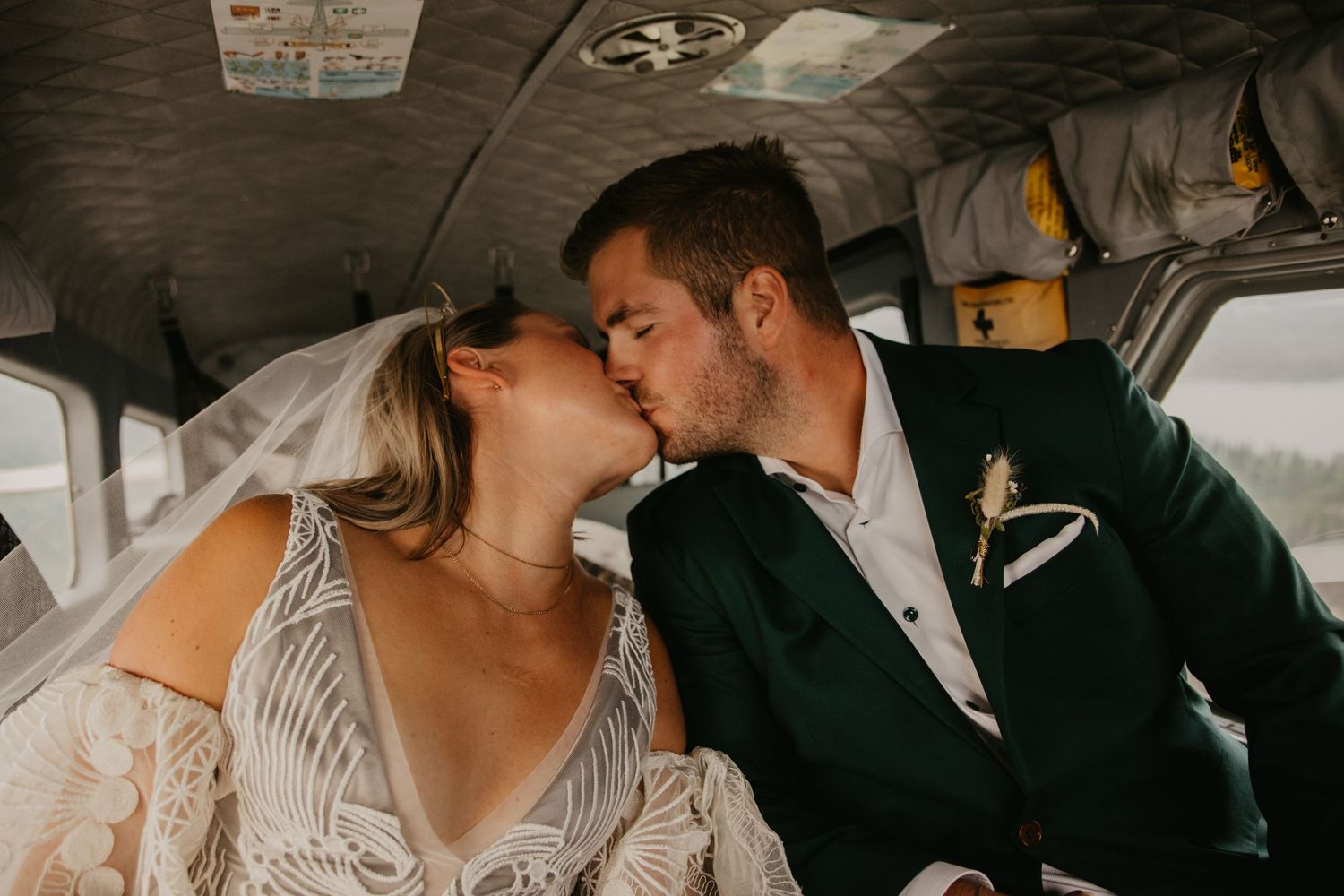 Intimate moment captured inside small aircraft cabin.