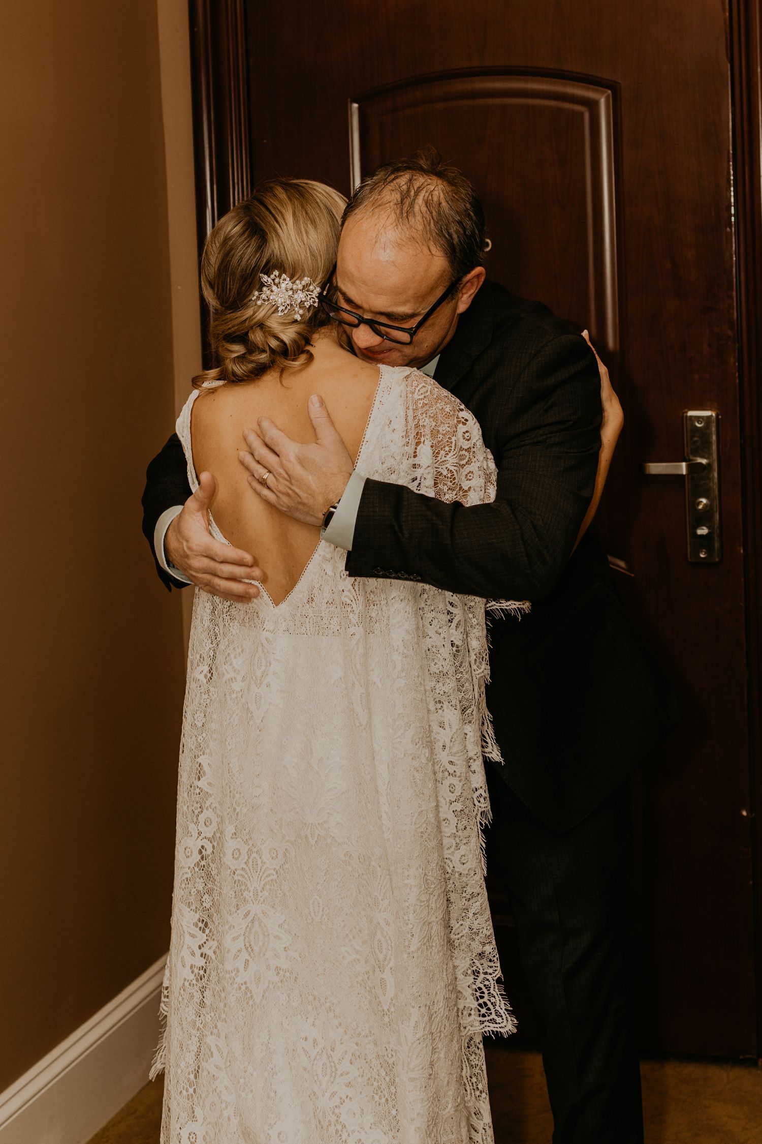An emotional moment shared between two people before a wedding ceremony.