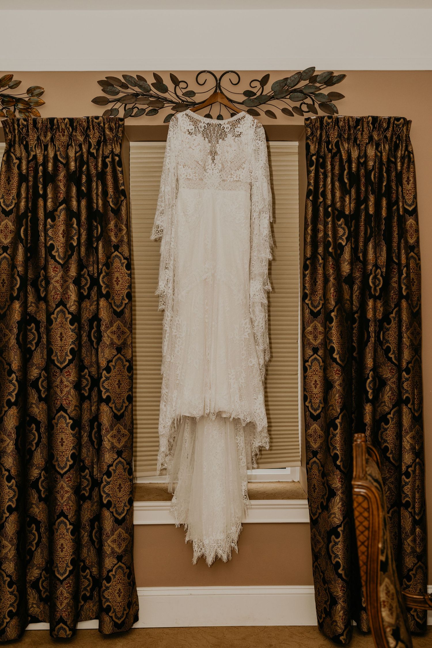 Close-up detail of delicate lace trim on a white wedding dress.